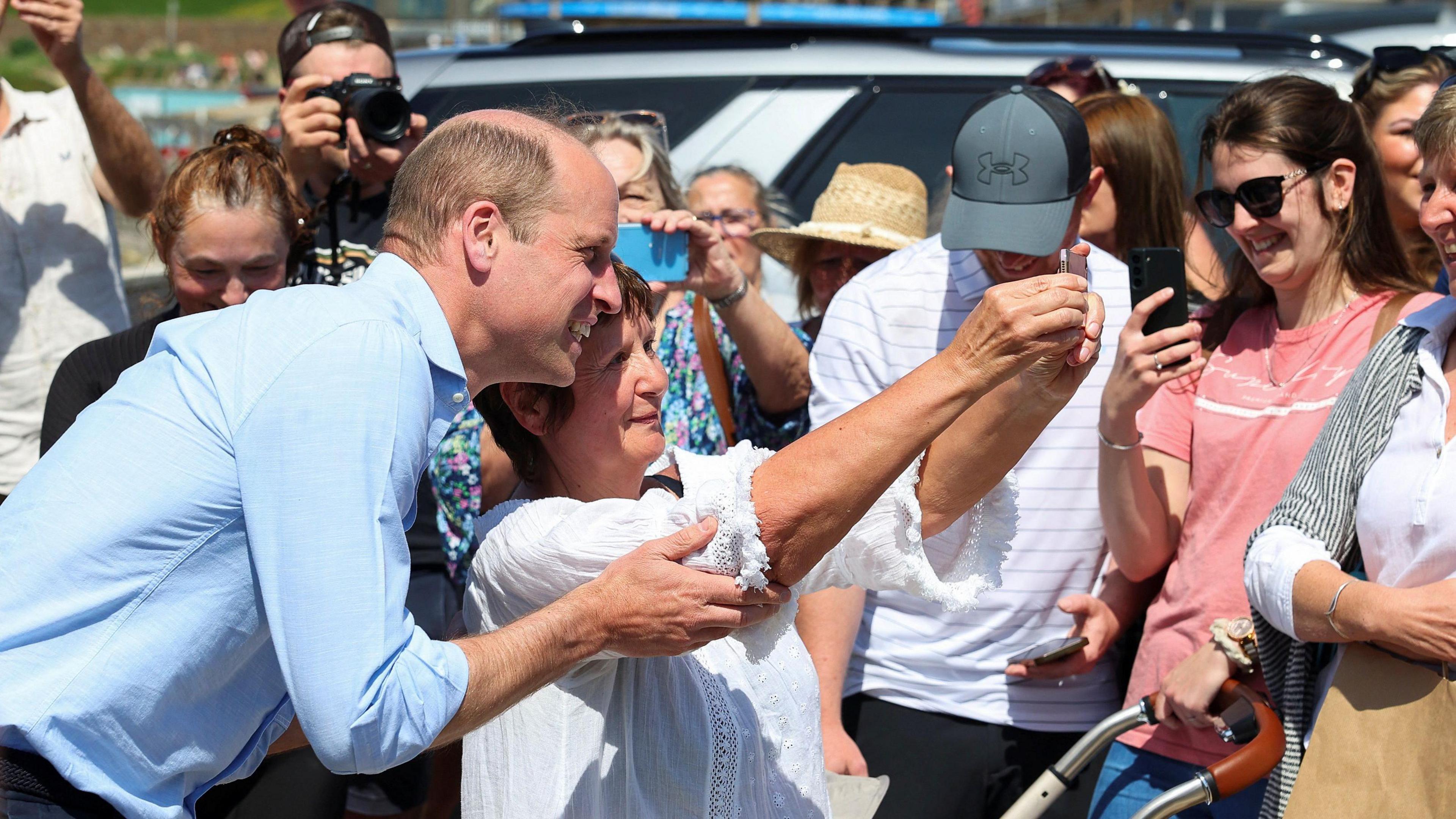 Prince William having a selfie taken by a member of the public