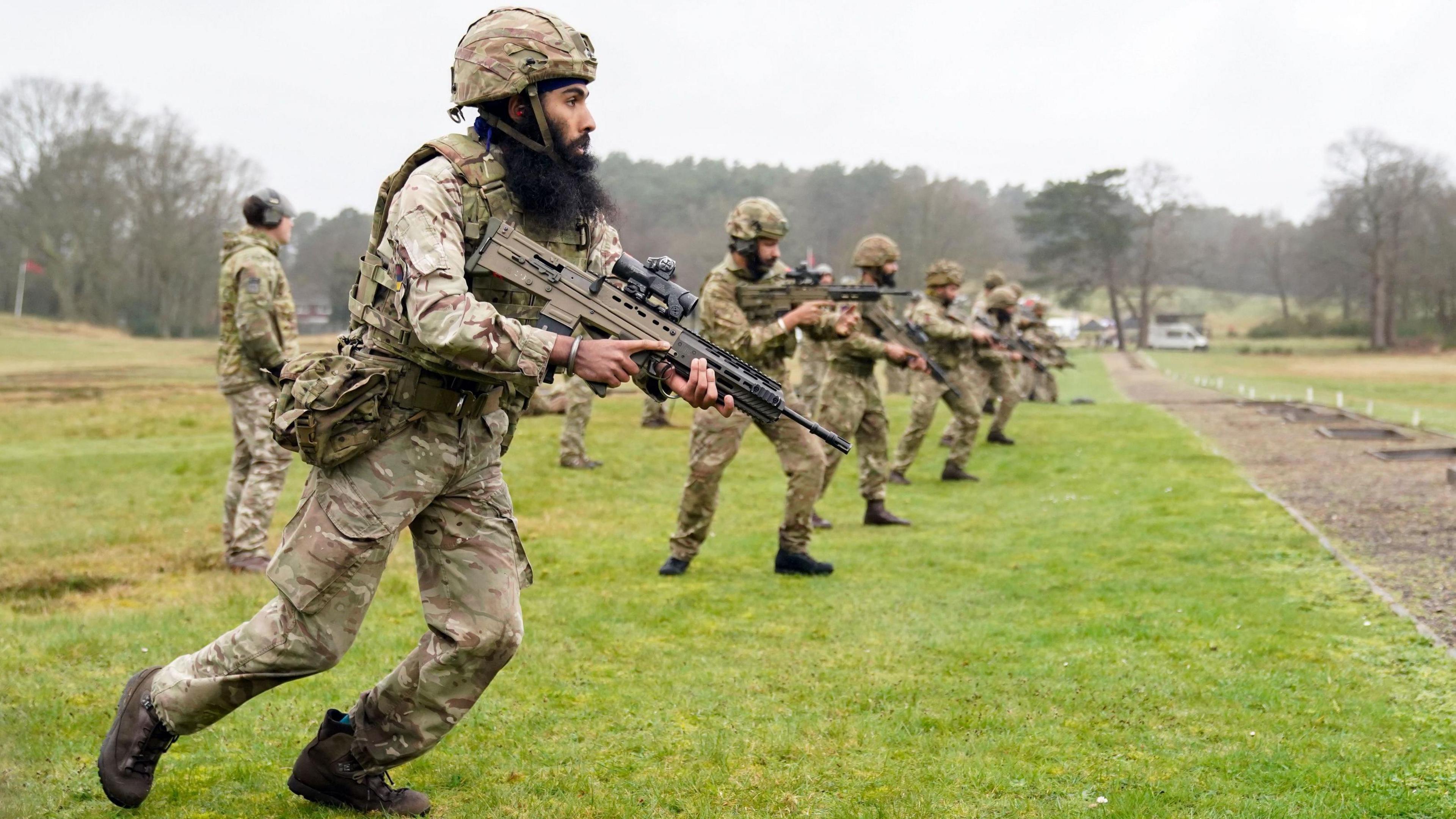 Sikh soldiers of the British Army during a shooting competition during the Holla Mahalla Sikh military festival, at the Aldershot Garrison, Hampshire.