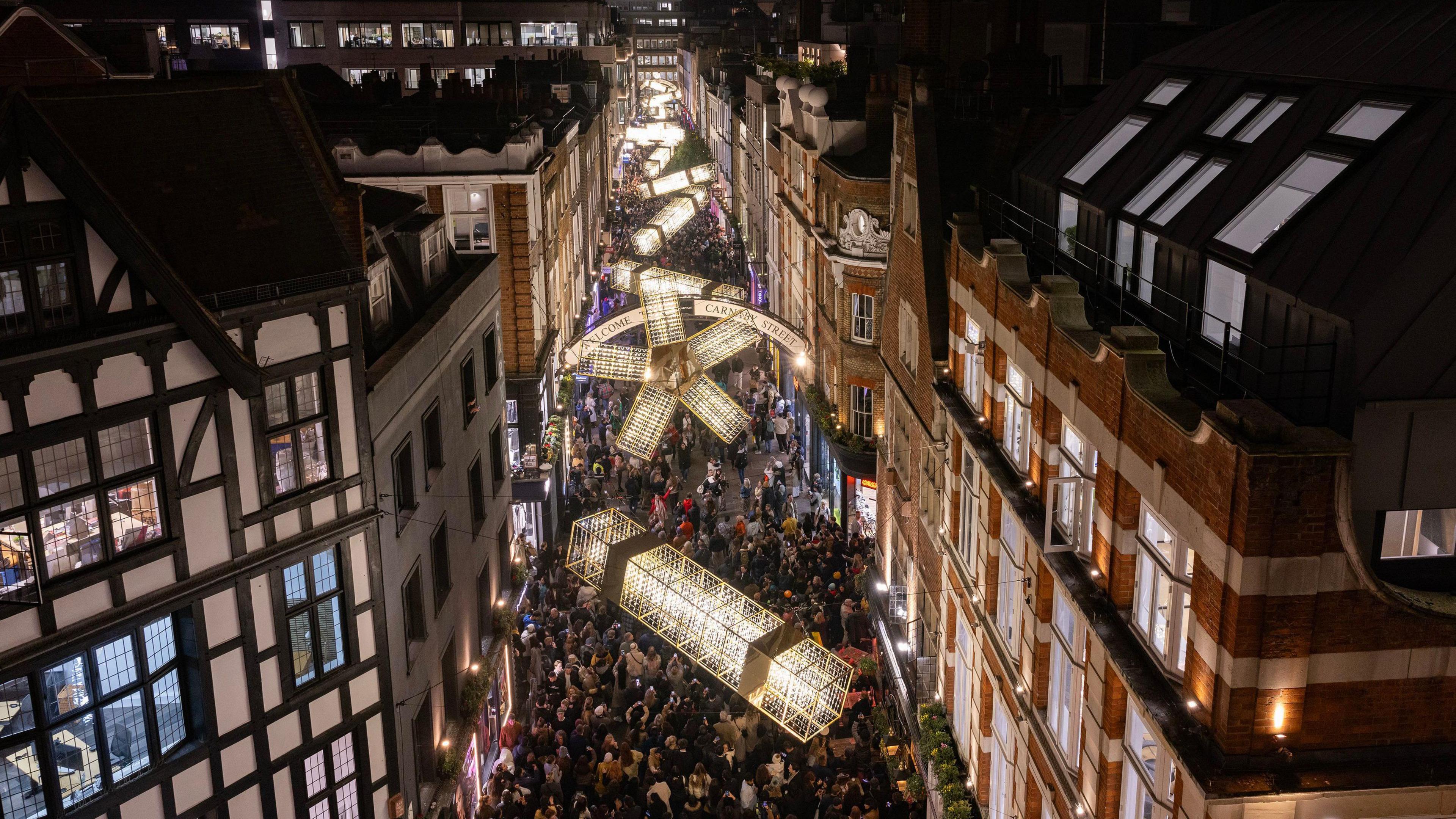 Carnaby Street lights which are made to look like Christmas crackers and a large bow