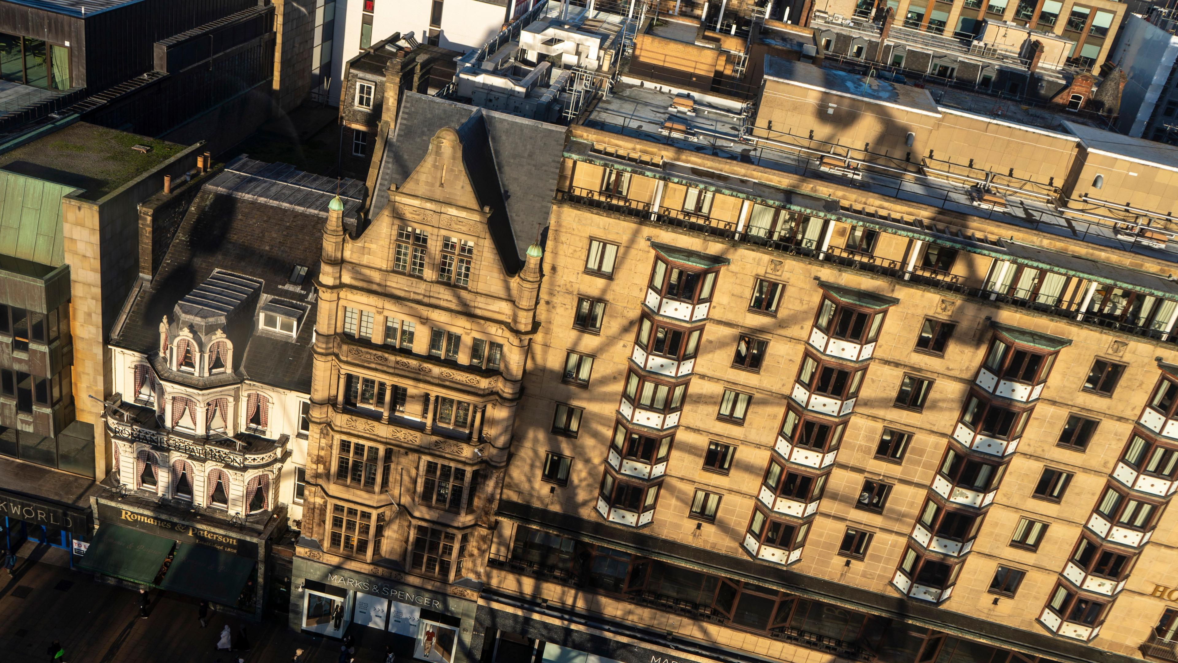 Shadow of a big wheel on a tenement building