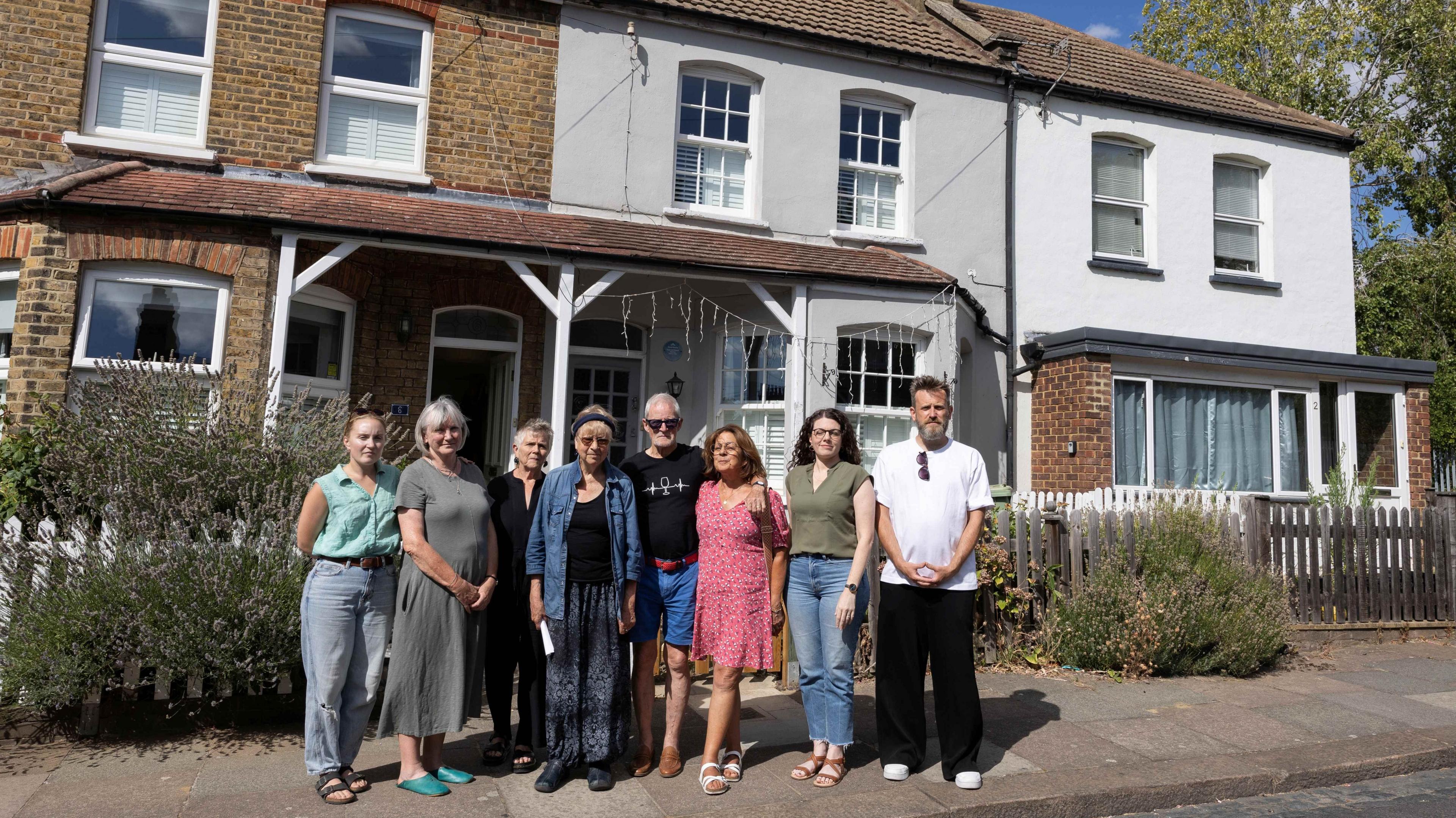 Picture of neighbours standing in front of the house