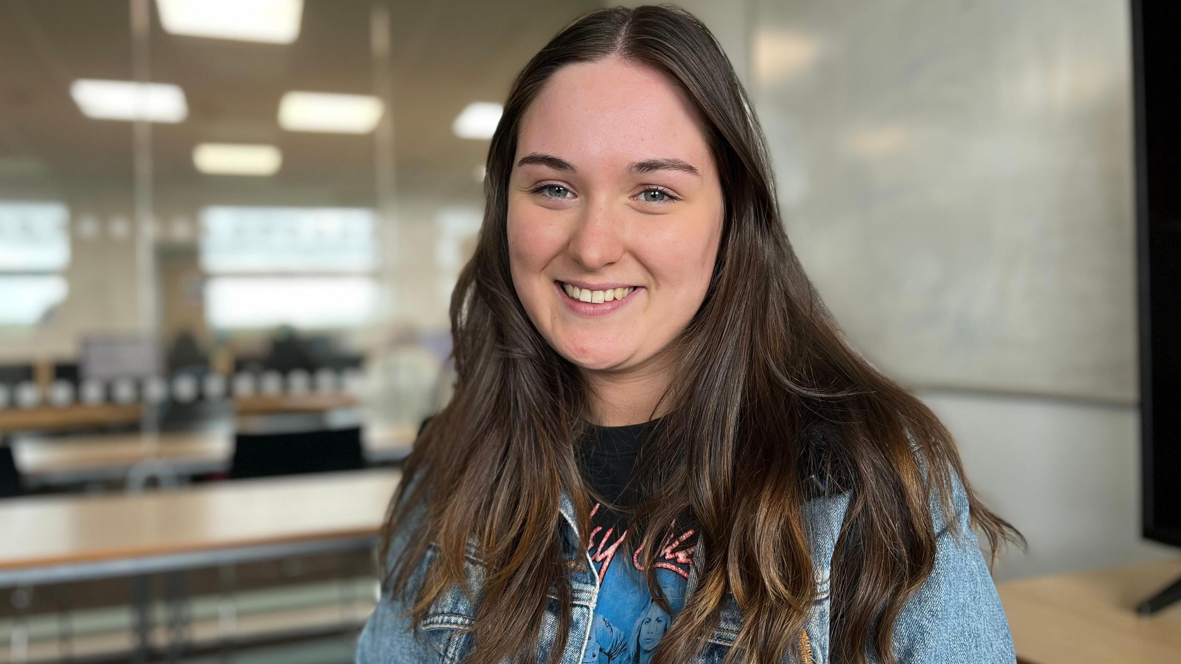 Erin Harrison at Lakes College. She has long, dark hair and wears a denim jacket