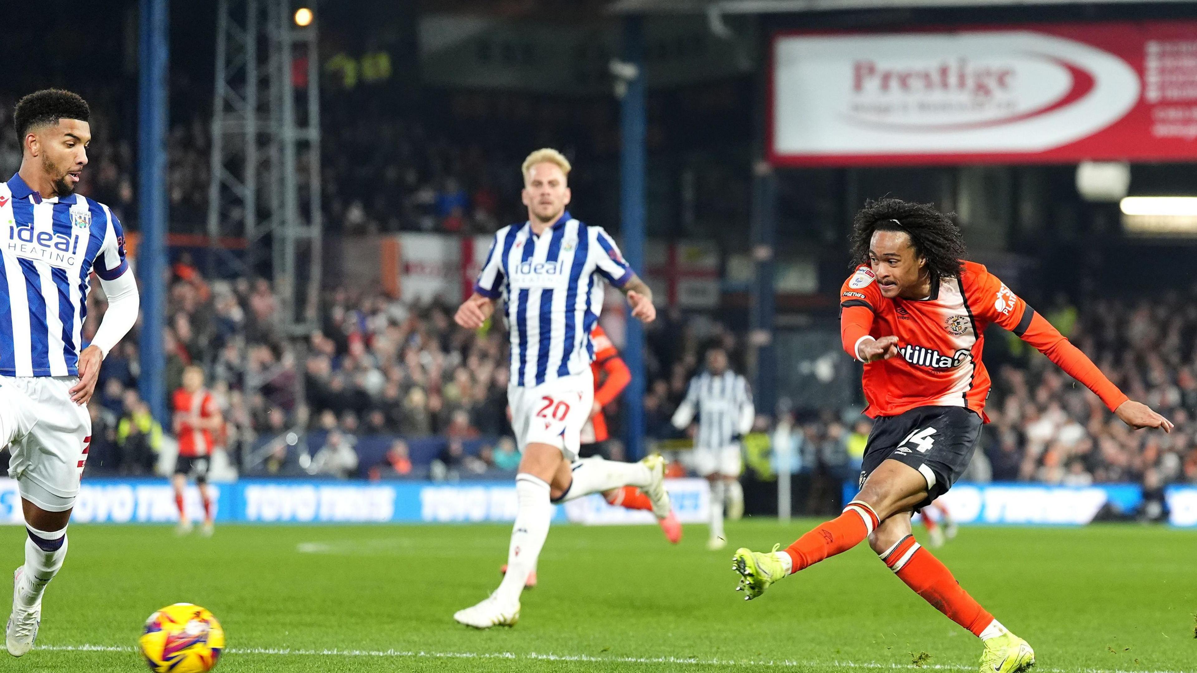 Tahith Chong unleashes the low left-foot shot that earned Luton their equaliser at home to West Bromwich Albion 