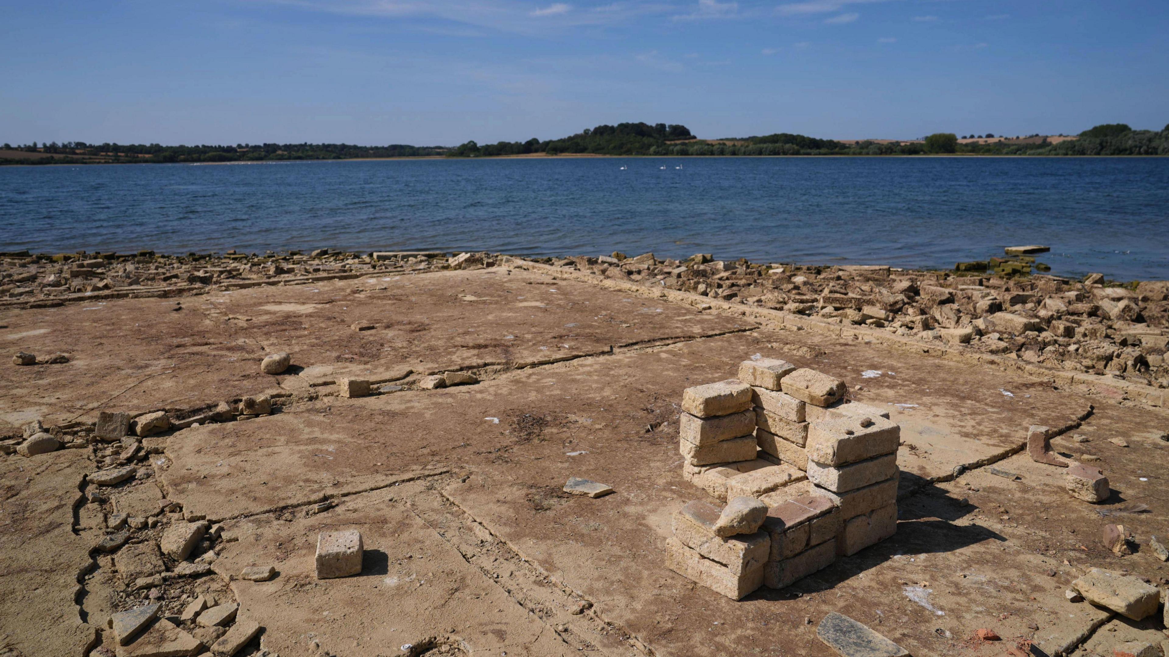 The remains of the building's foundations and some of the reservoir.