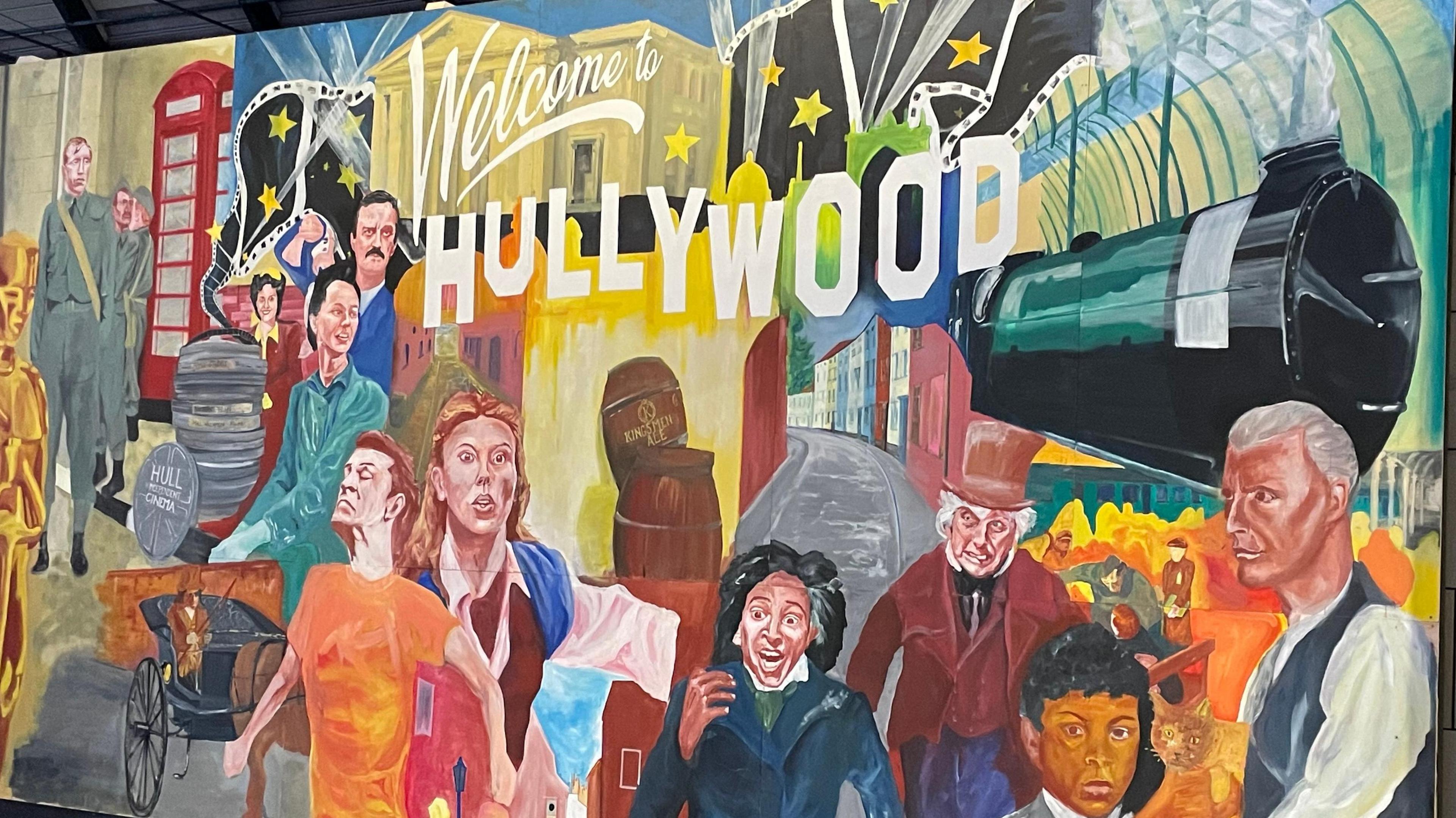 A mural showing illustrations of characters from different films: Enola Holmes, The Personal History of David Copperfield and Blitz