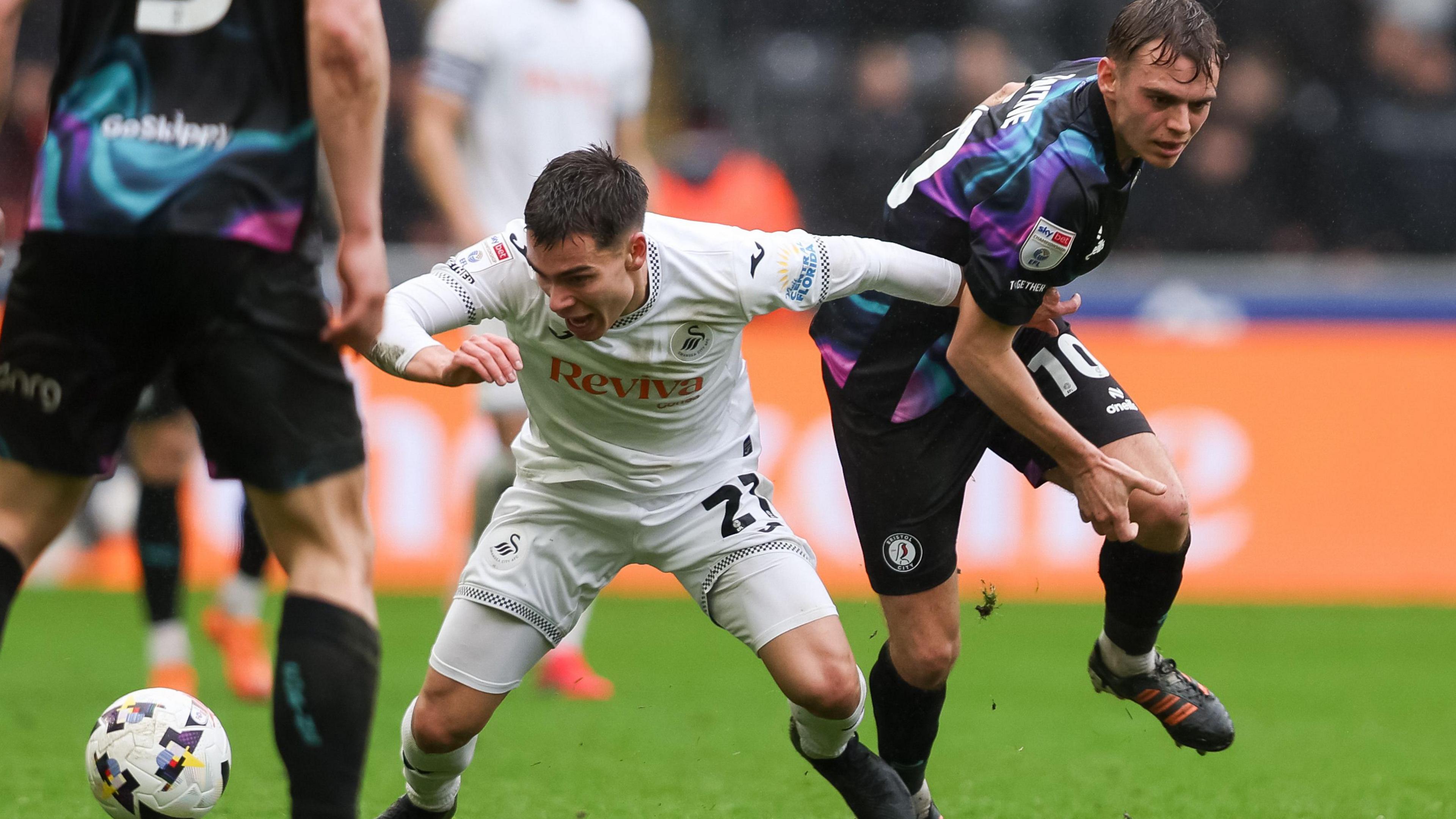 Scott Twine of Bristol City fouls Leo Walta of Swansea City 