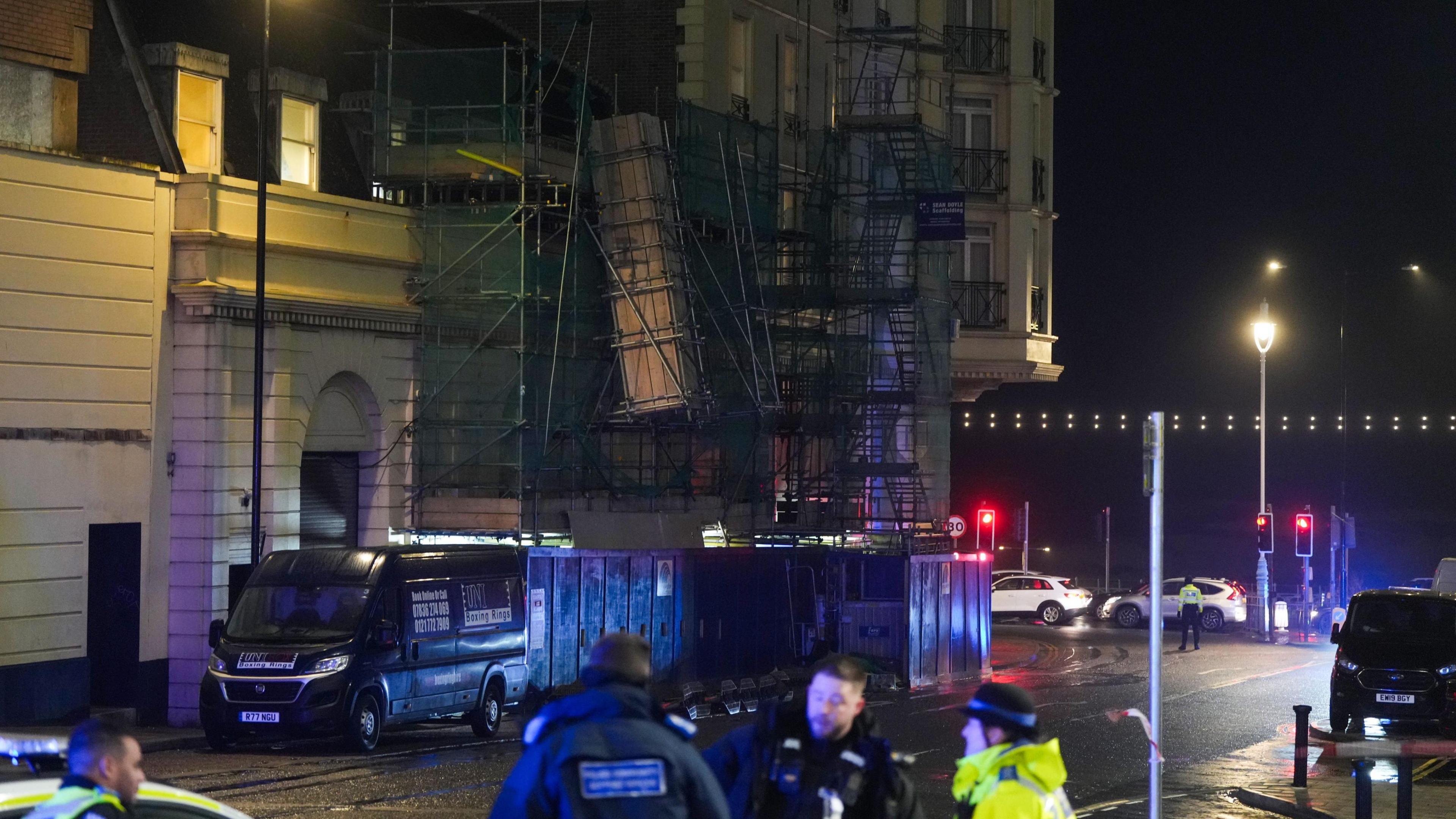 Police officers on Cannon Street, next to a large unbalanced bit of scaffolding. 