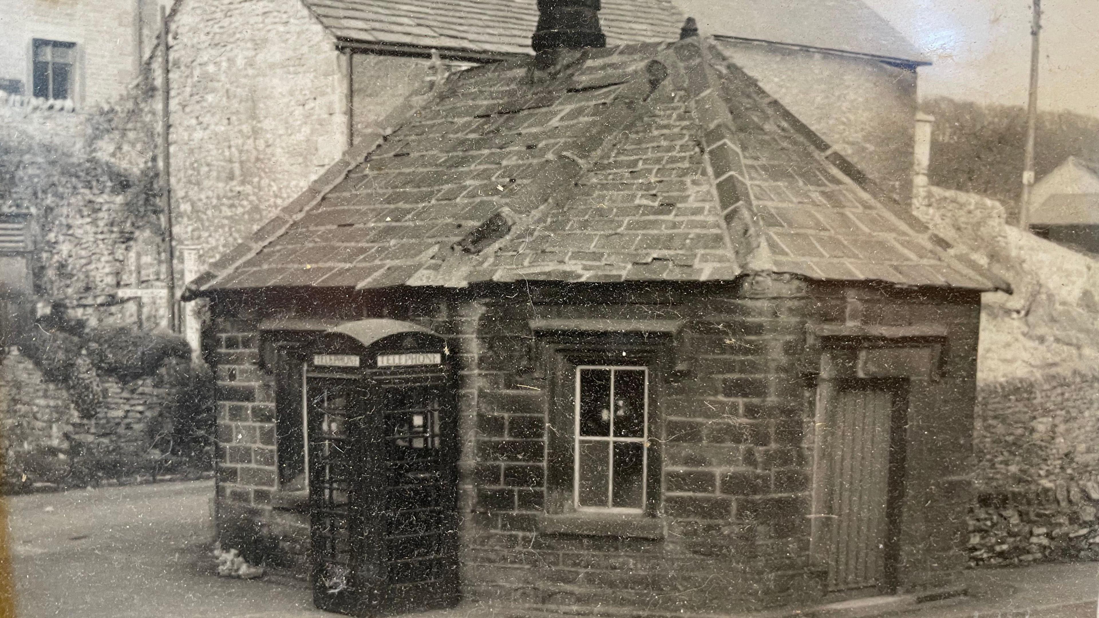 Black and white picture of small octagonal building