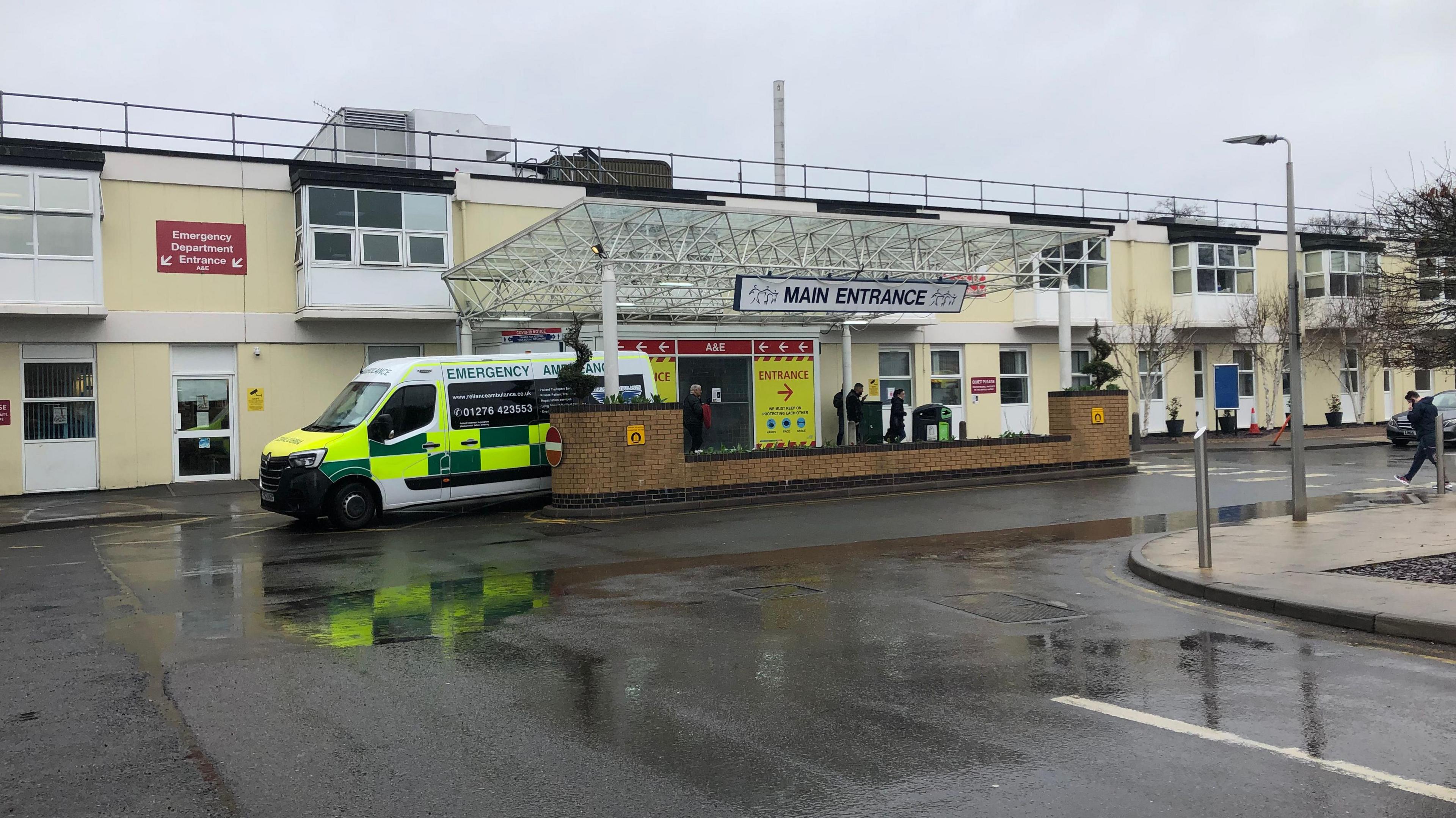 Main entrance to Frimley Park Hospital, ambulance in doorway