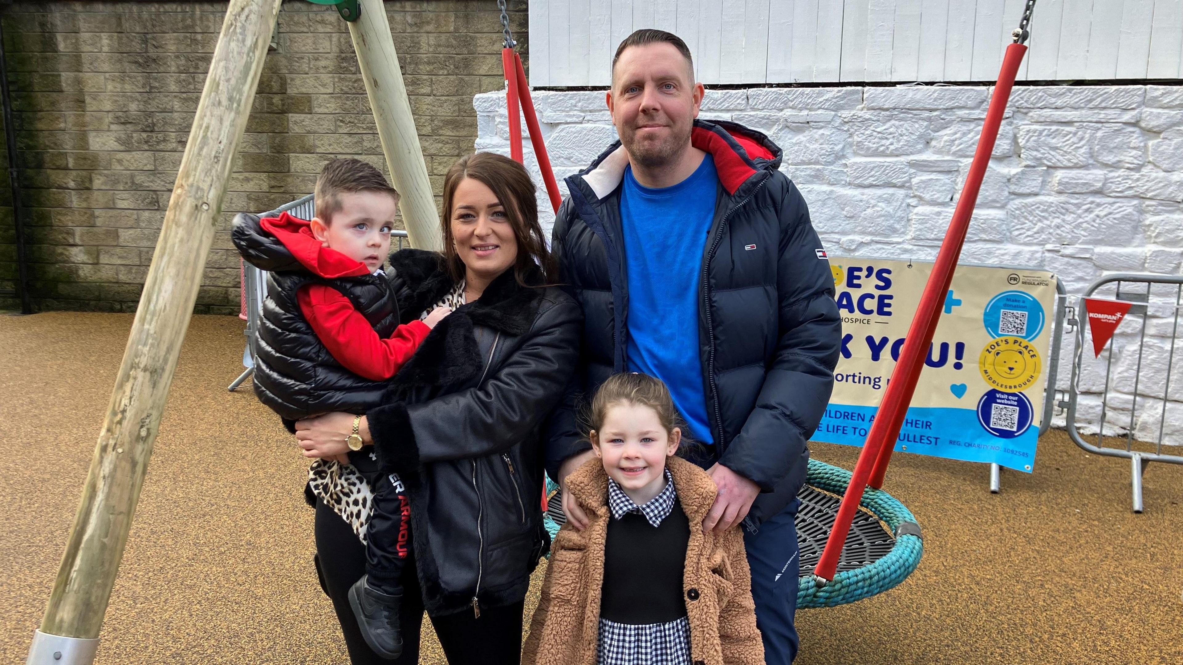 Rylee Flanagan, four, with his parents and sister Alyssa, five, at Zoe’s Place