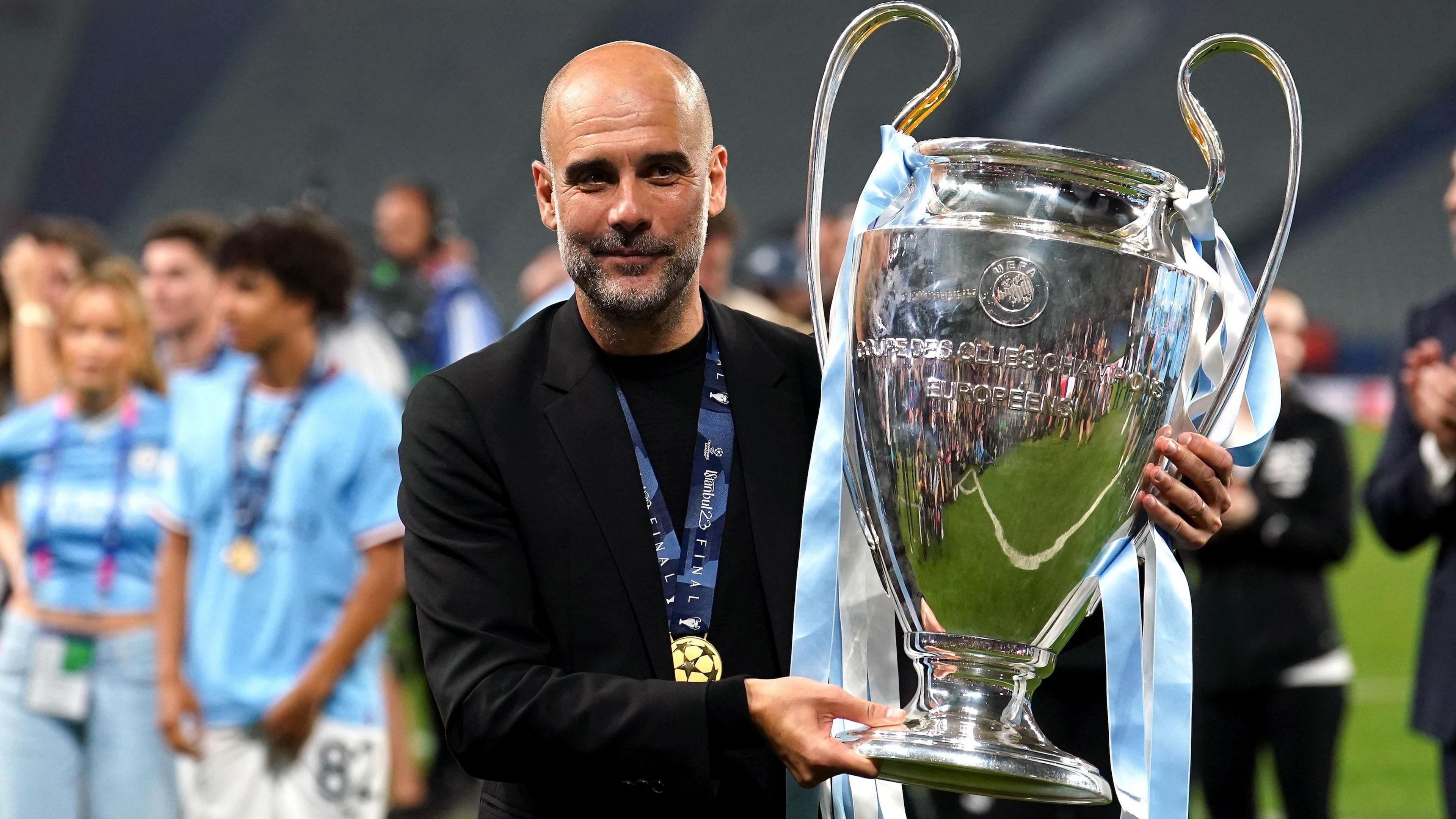 Pep Guardiola with the UEFA Champions League trophy.