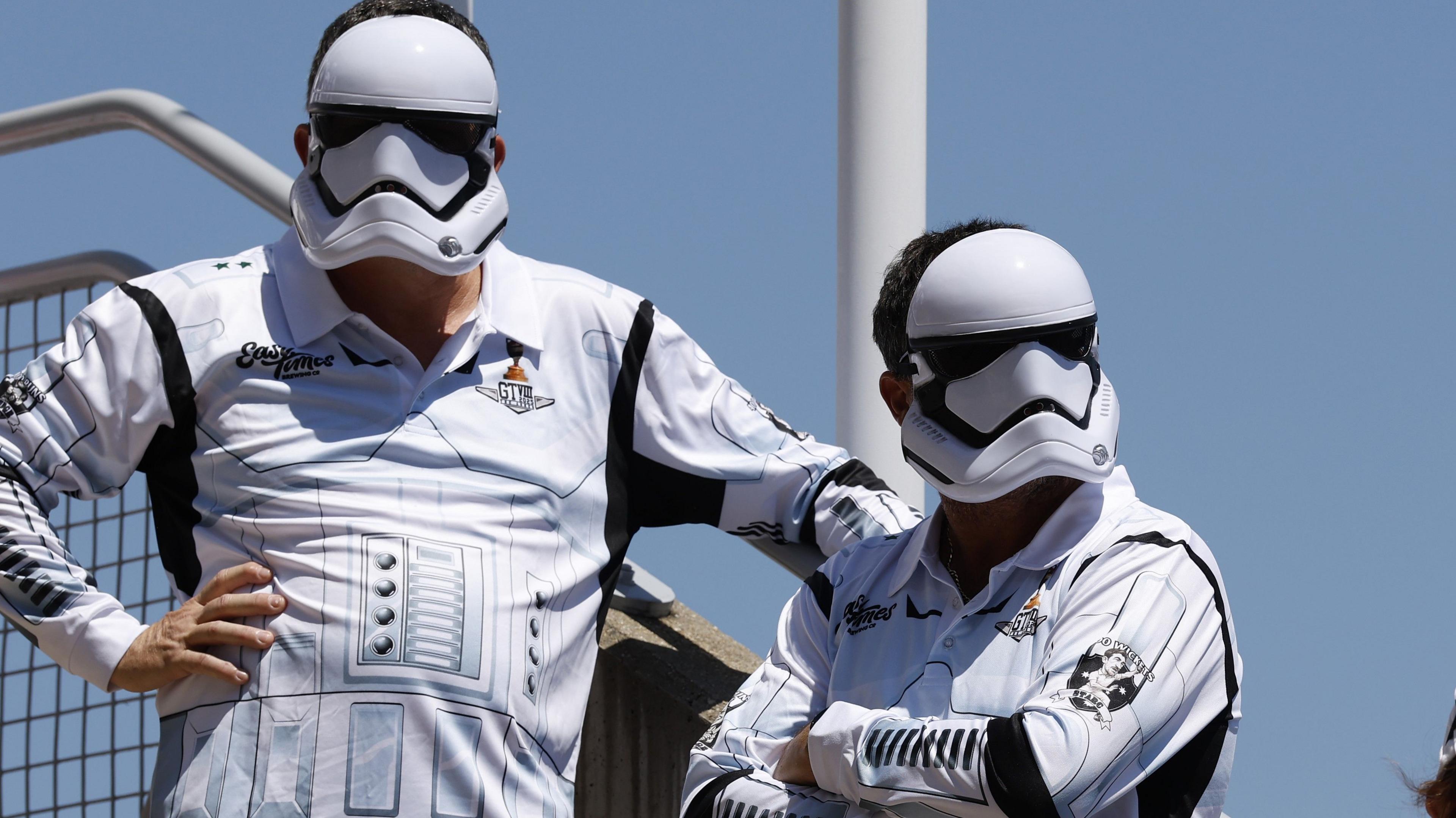 Spectators dressed as stormtroopers