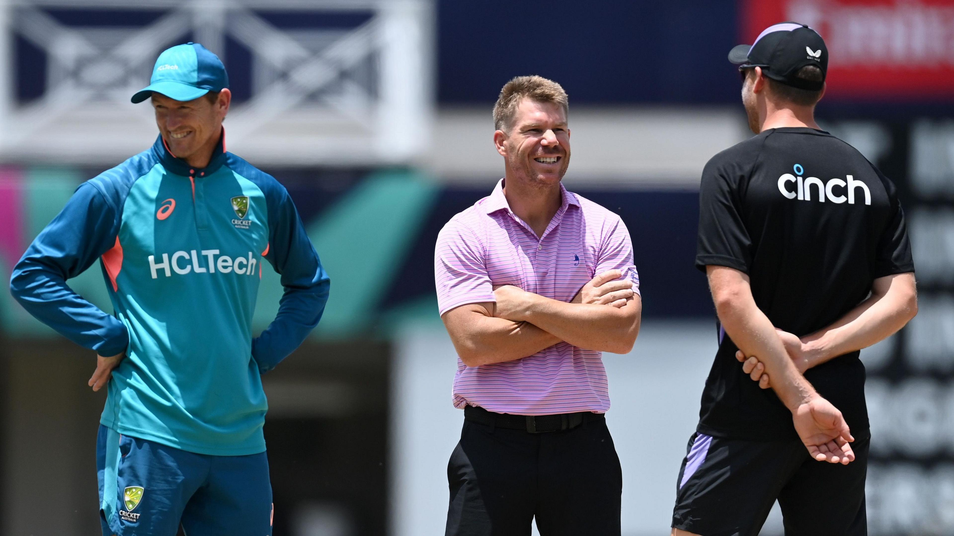 David Warner speaks to Jos Buttler at Kensington Oval