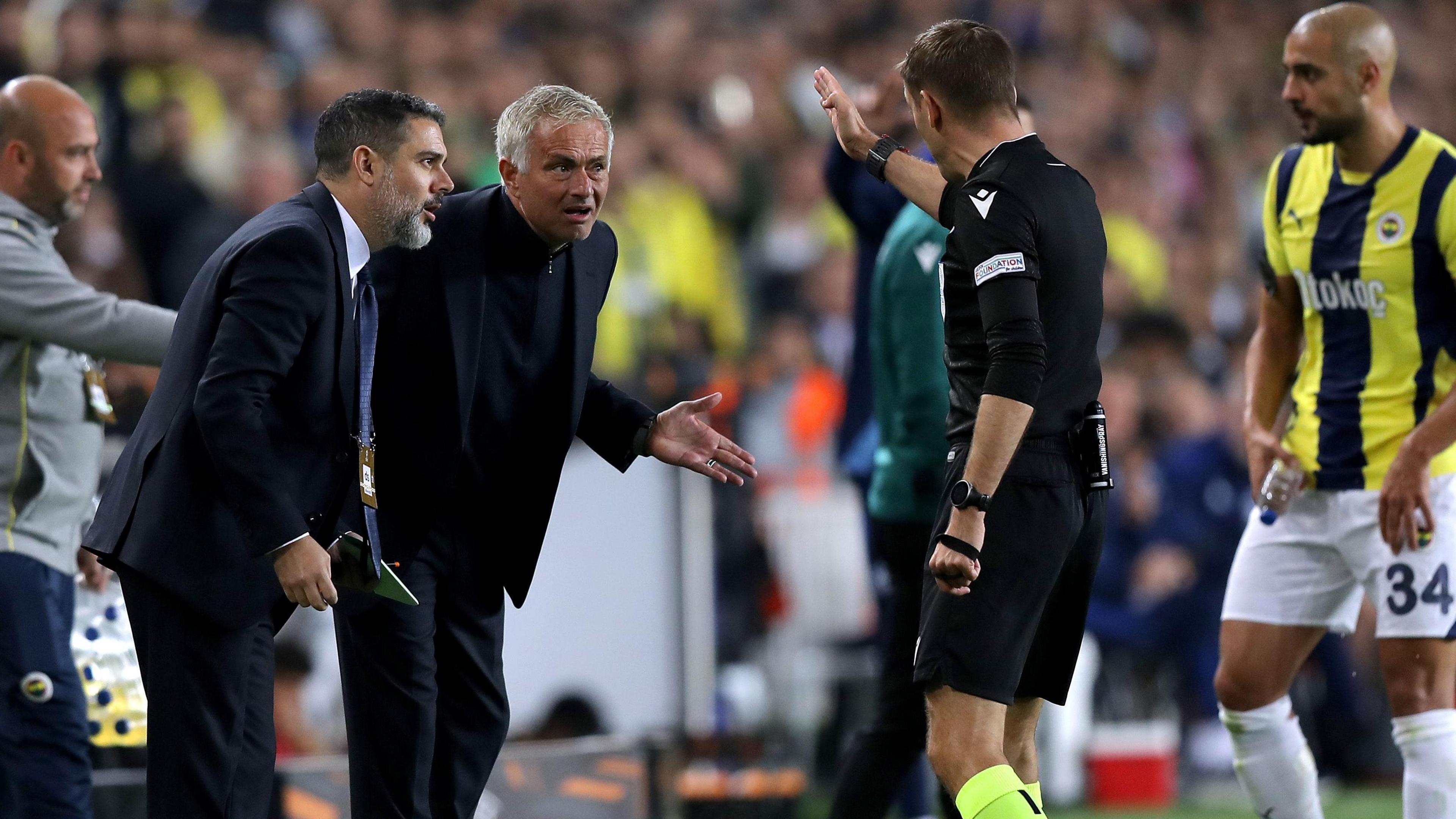 Fenerbahce manager Jose Mourinho is shown a red card by referee Clement Turpin in the second half against Manchester United.