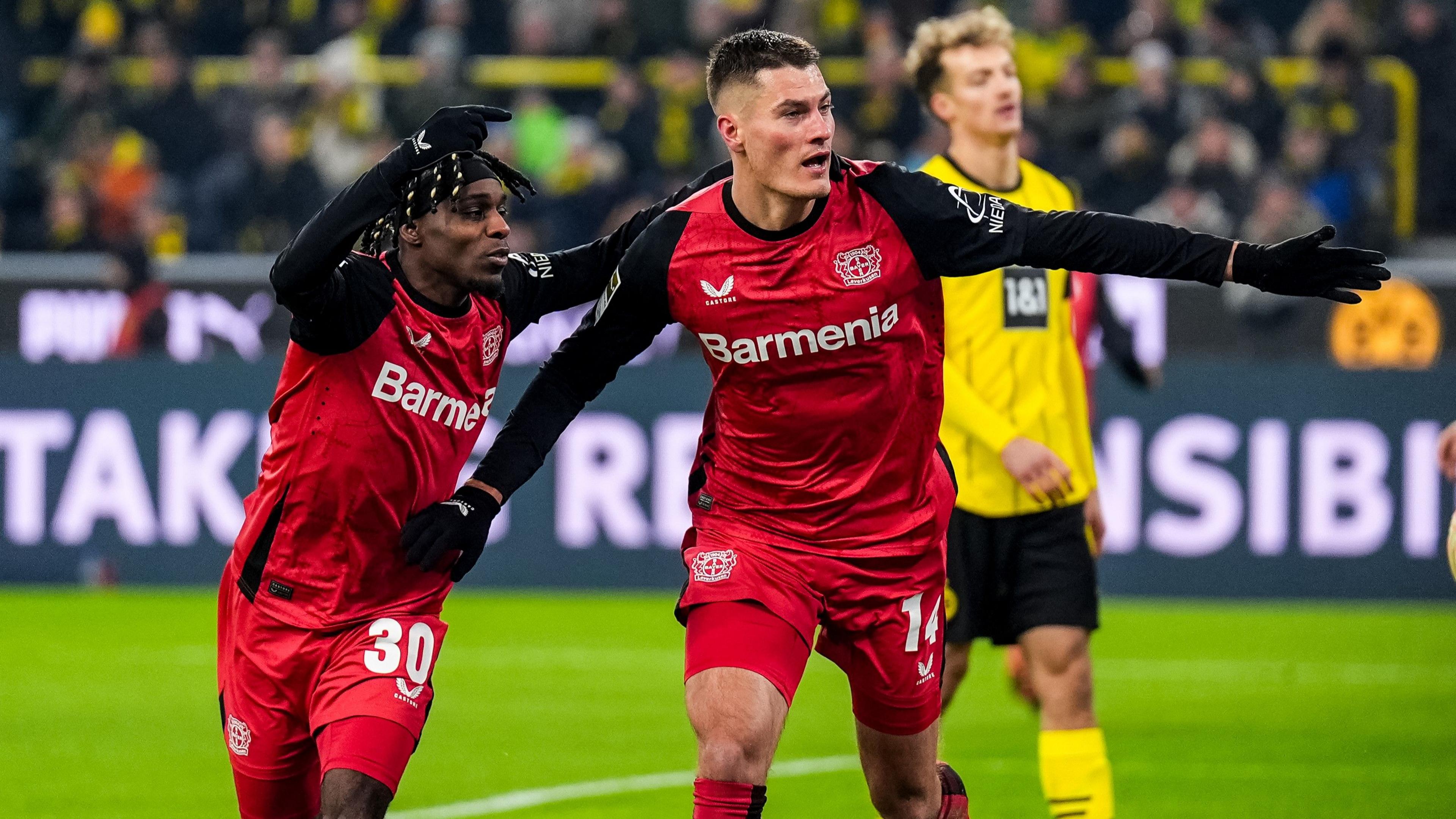 Bayer Leverkusen celebrate after Patrik Schick scores against Borussia Dortmund