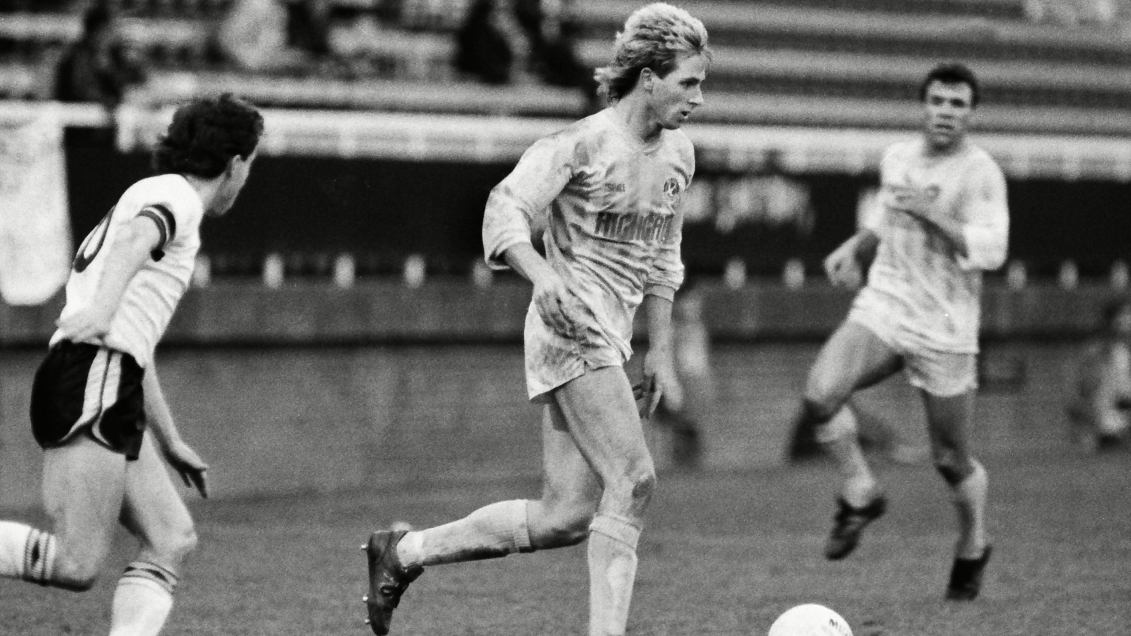 David Kelly dribbling with the ball for Walsall during a game in the 1980s