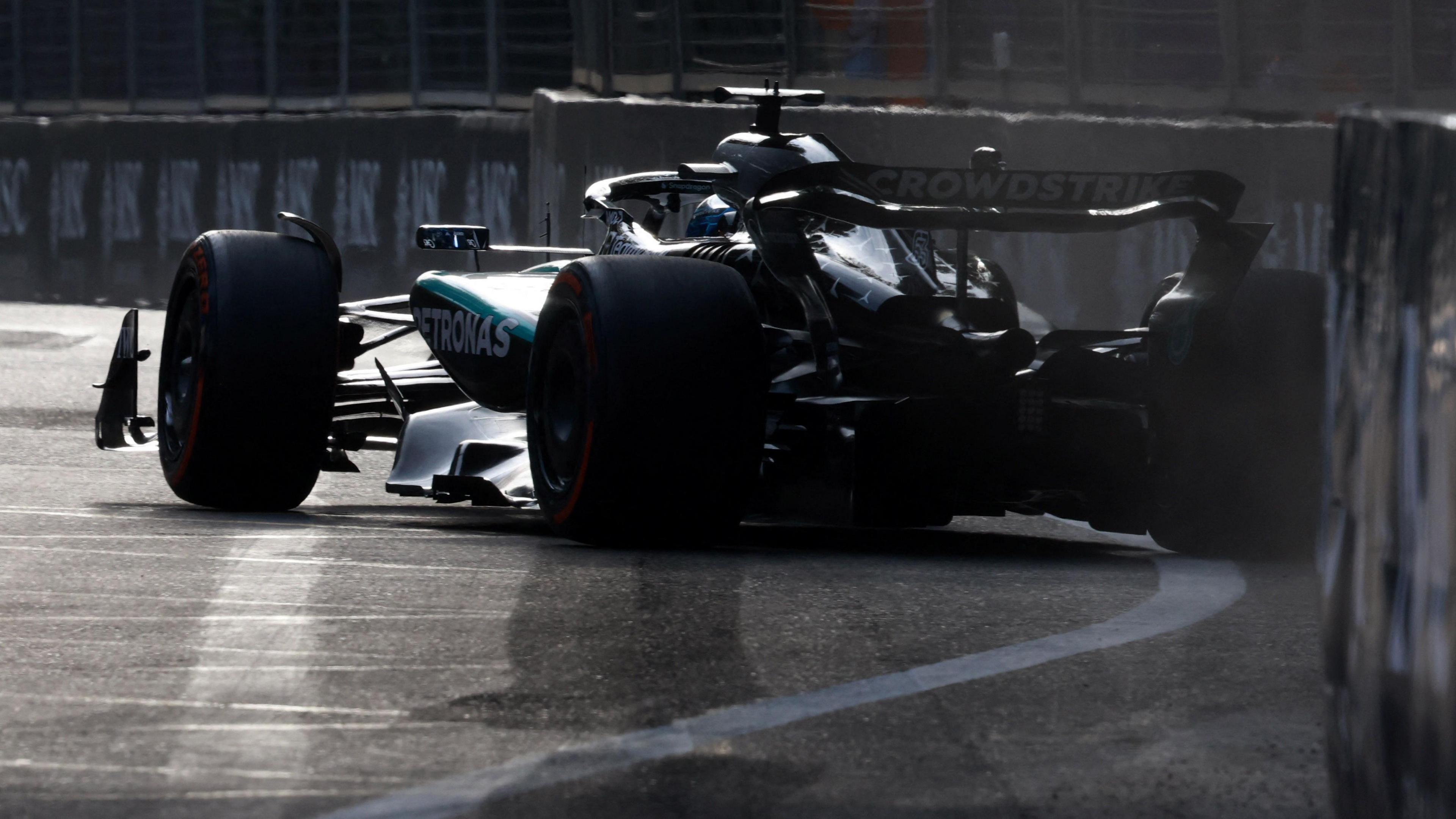 A rear view of the  Mercedes of George Russell sliding and hitting the wall during second practice for the Azerbaijan Grand Prix