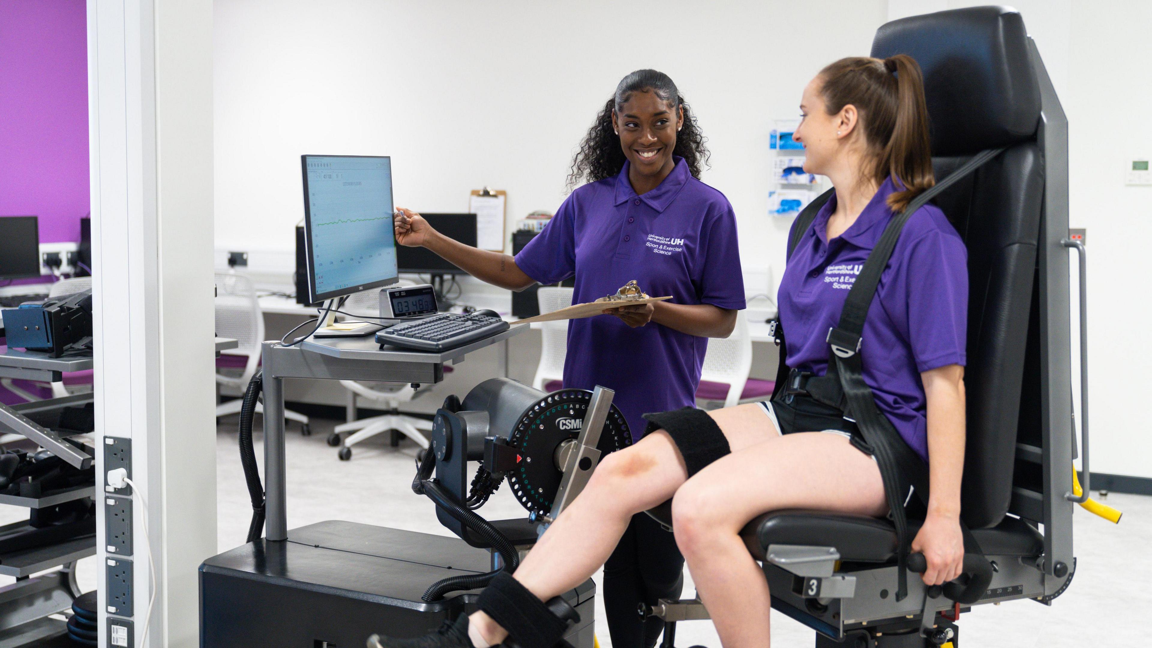 Student using gym equipment