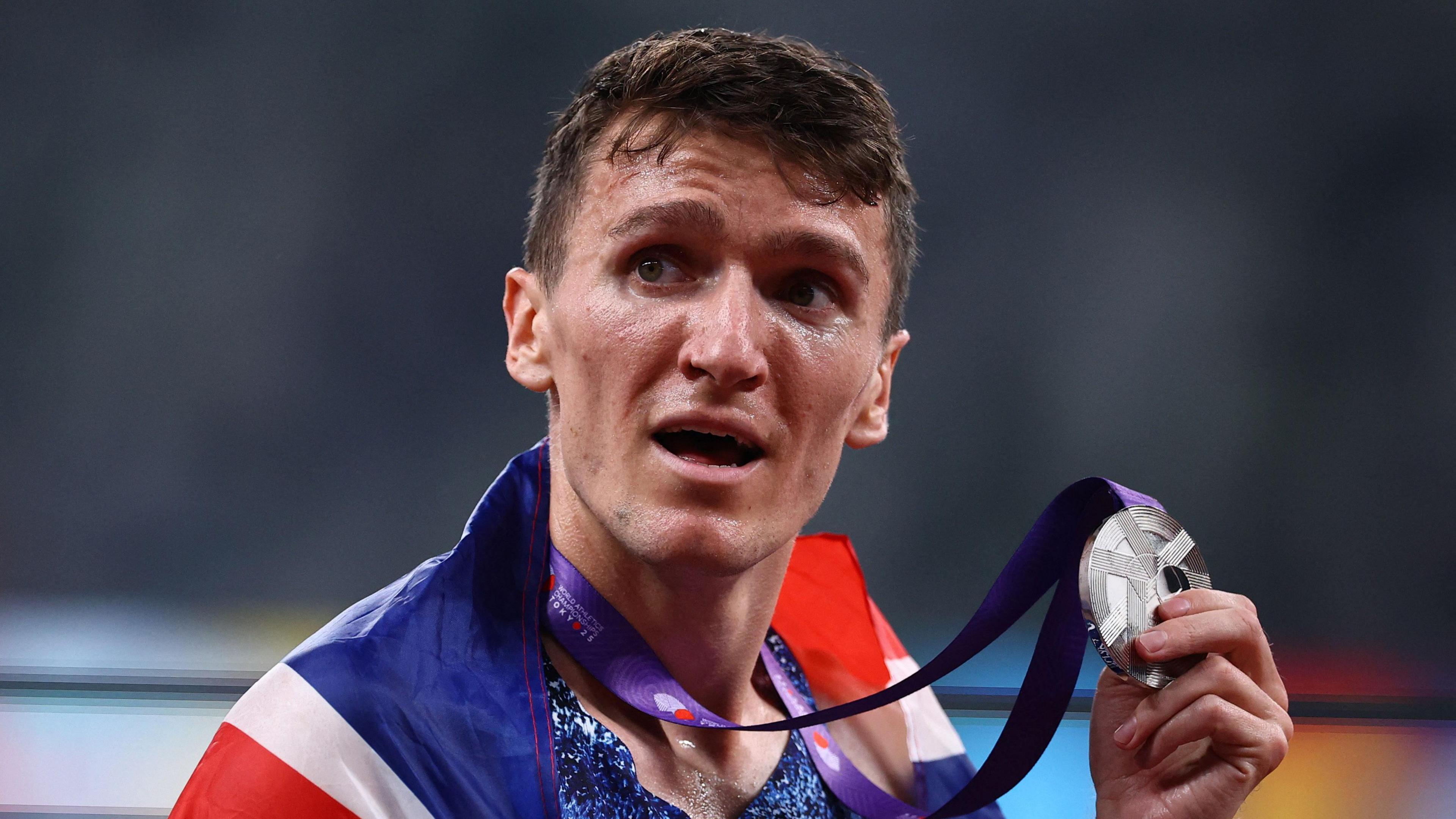 Jake Wightman holding his medal