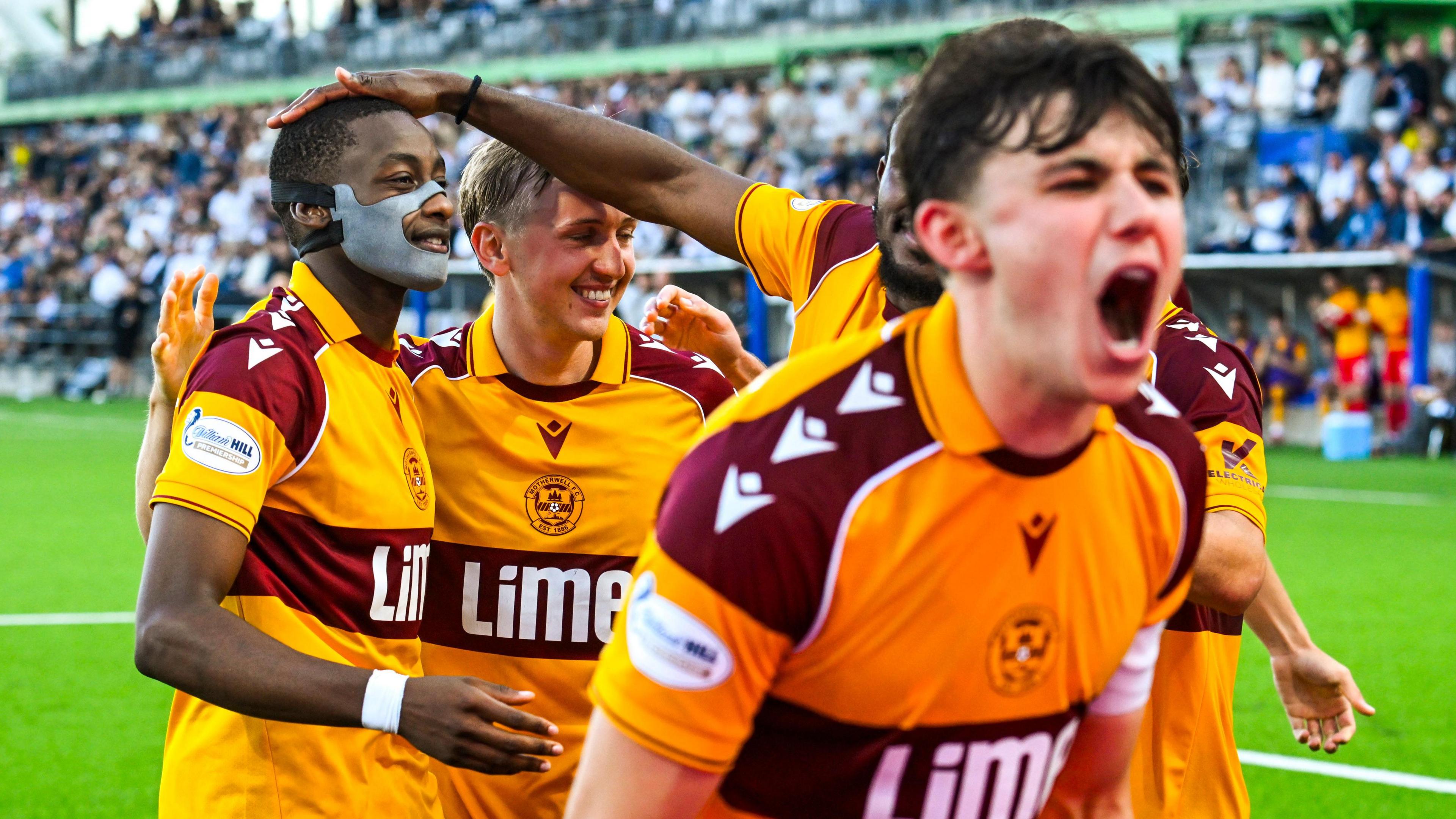 Motherwell players celebrate in front of their fans with goalscorer Tawanda Maswanhise
