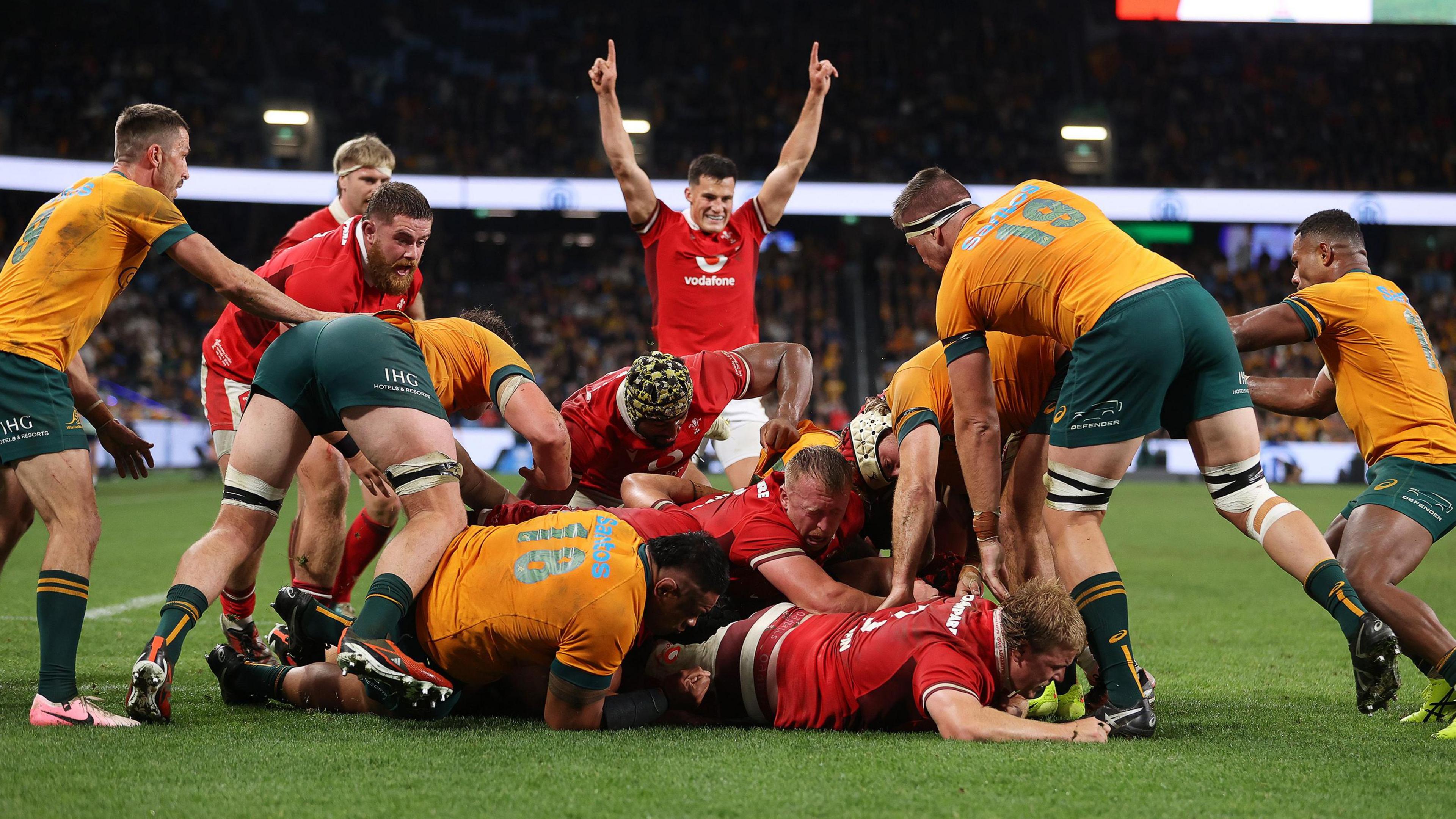 Wales players celebrate a try for James Botham but the score was disallowed