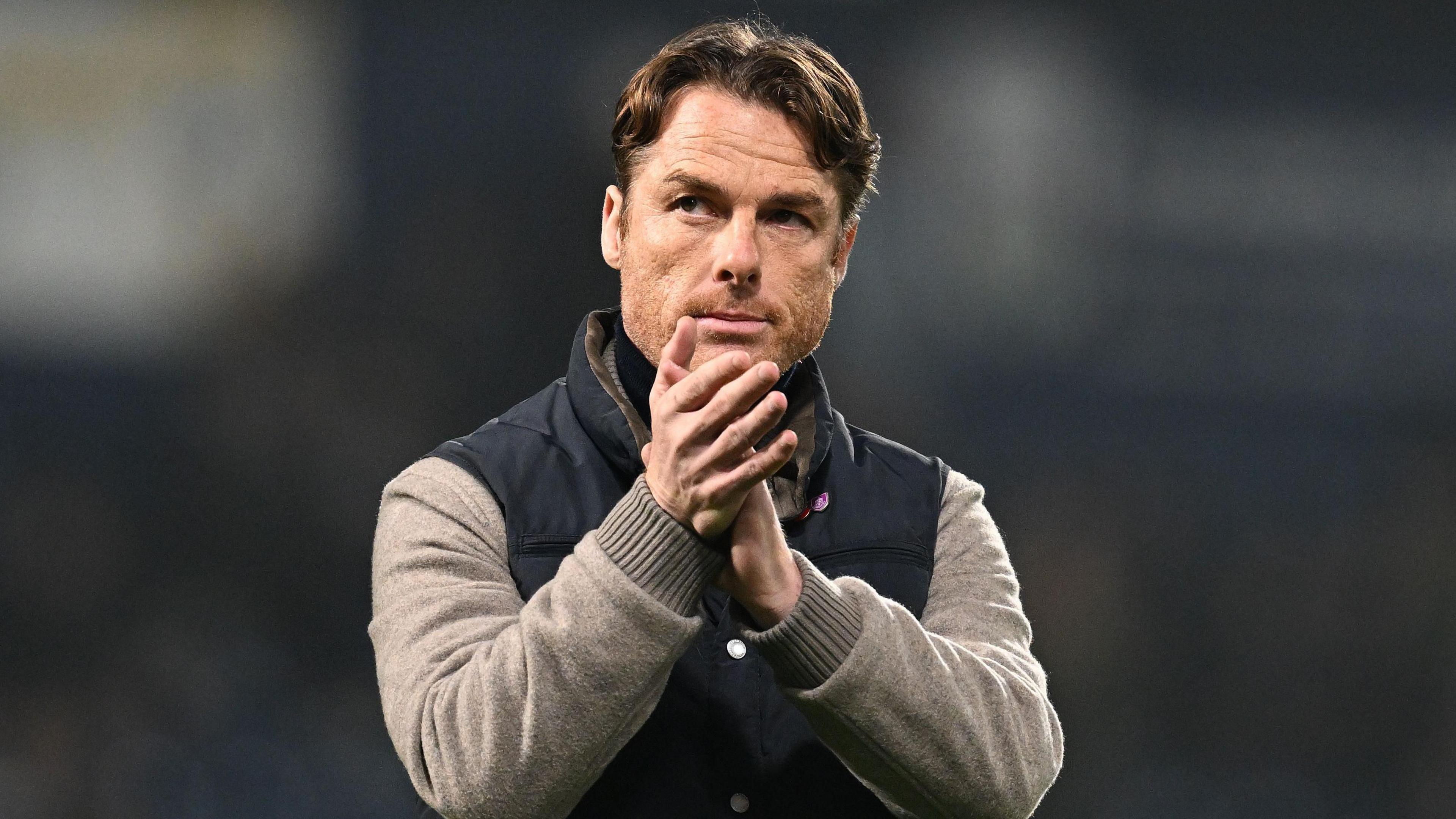 Burnley manager Scott Parker applauding fans at West Brom