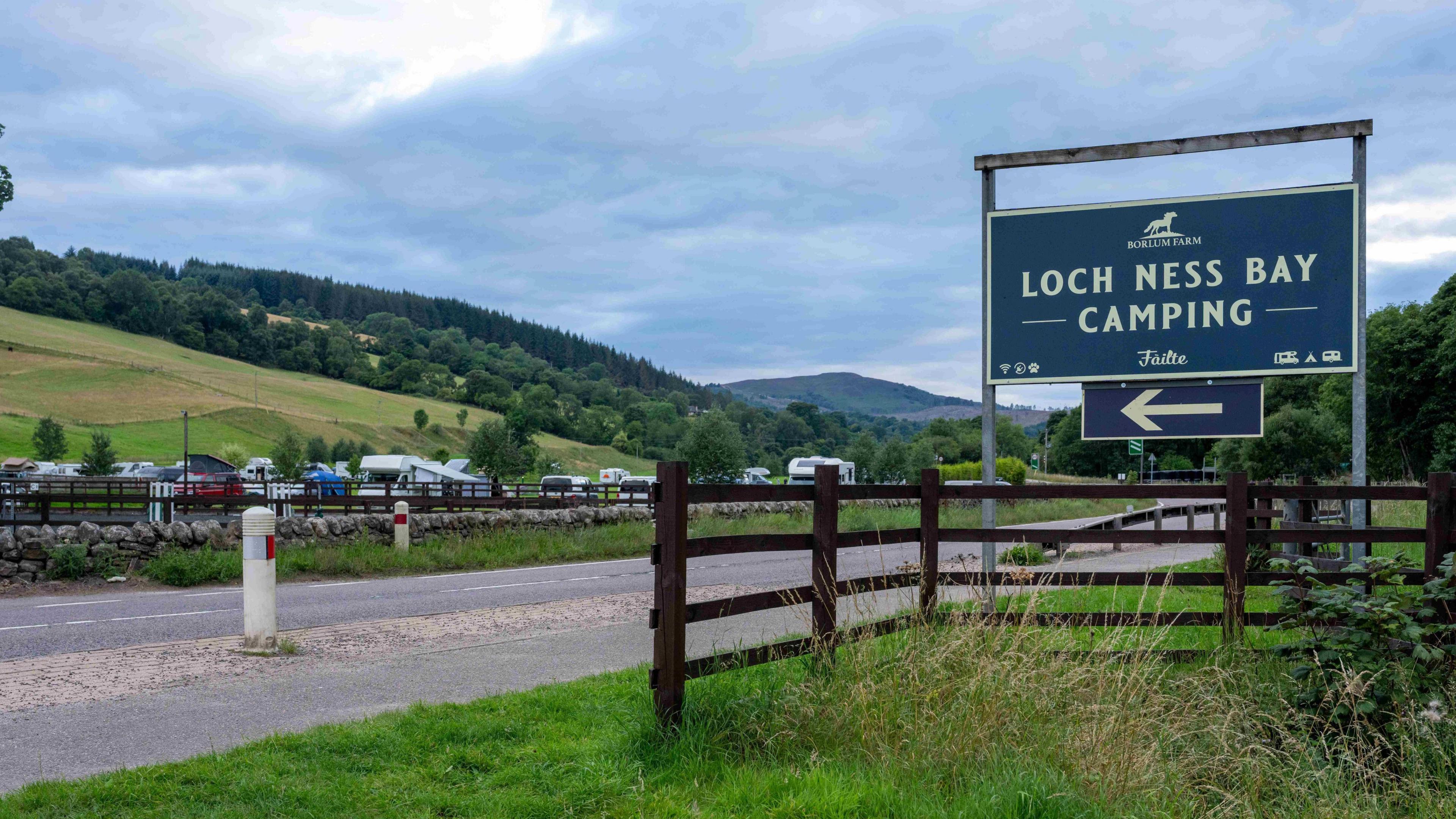 A camp site sign saying LOCH NESS BAY CAMPING
