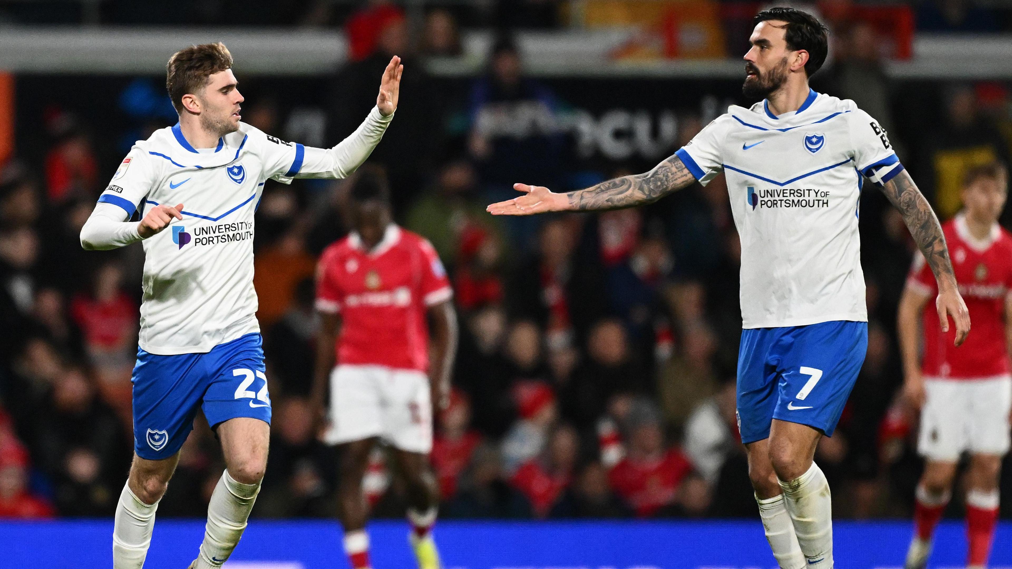 Portsmouth's Zak Swanson and Marlon Pack celebrate together after Swanson's goal in the 2-1 loss at Wrexham