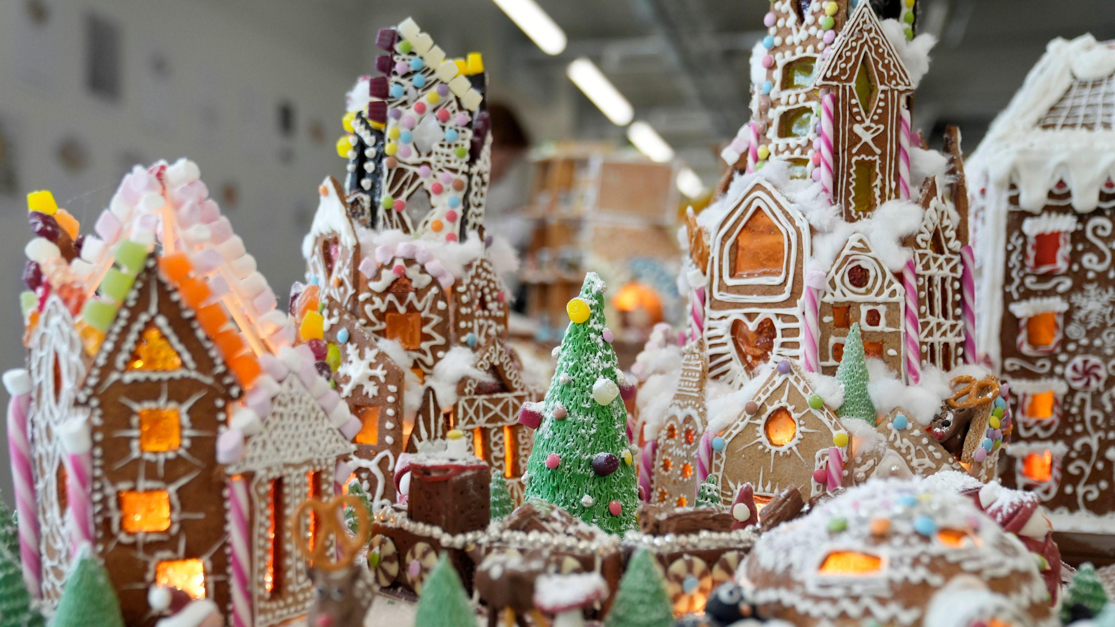 Gingerbread village with icing decorations and twinkling lights