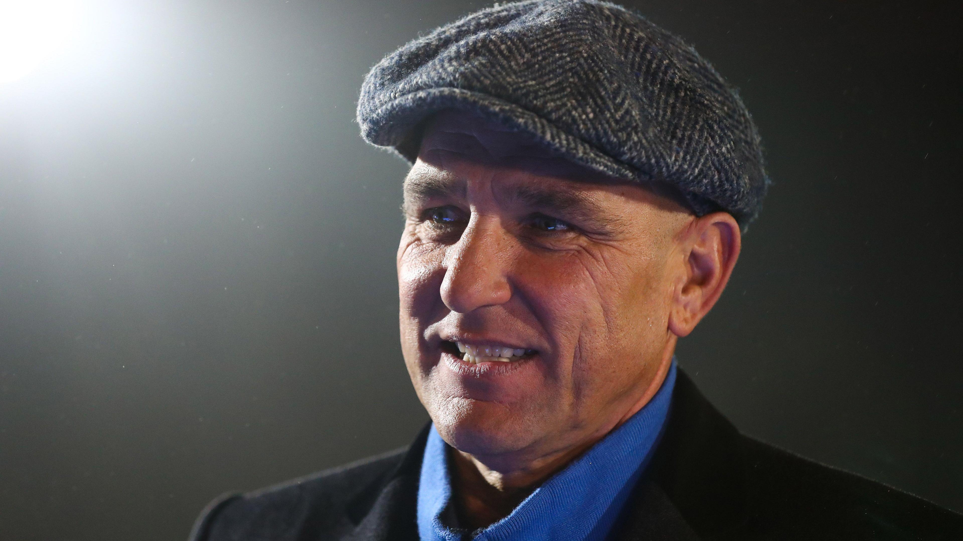 Vinnie Jones wearing a Peaky Blinders style cap.