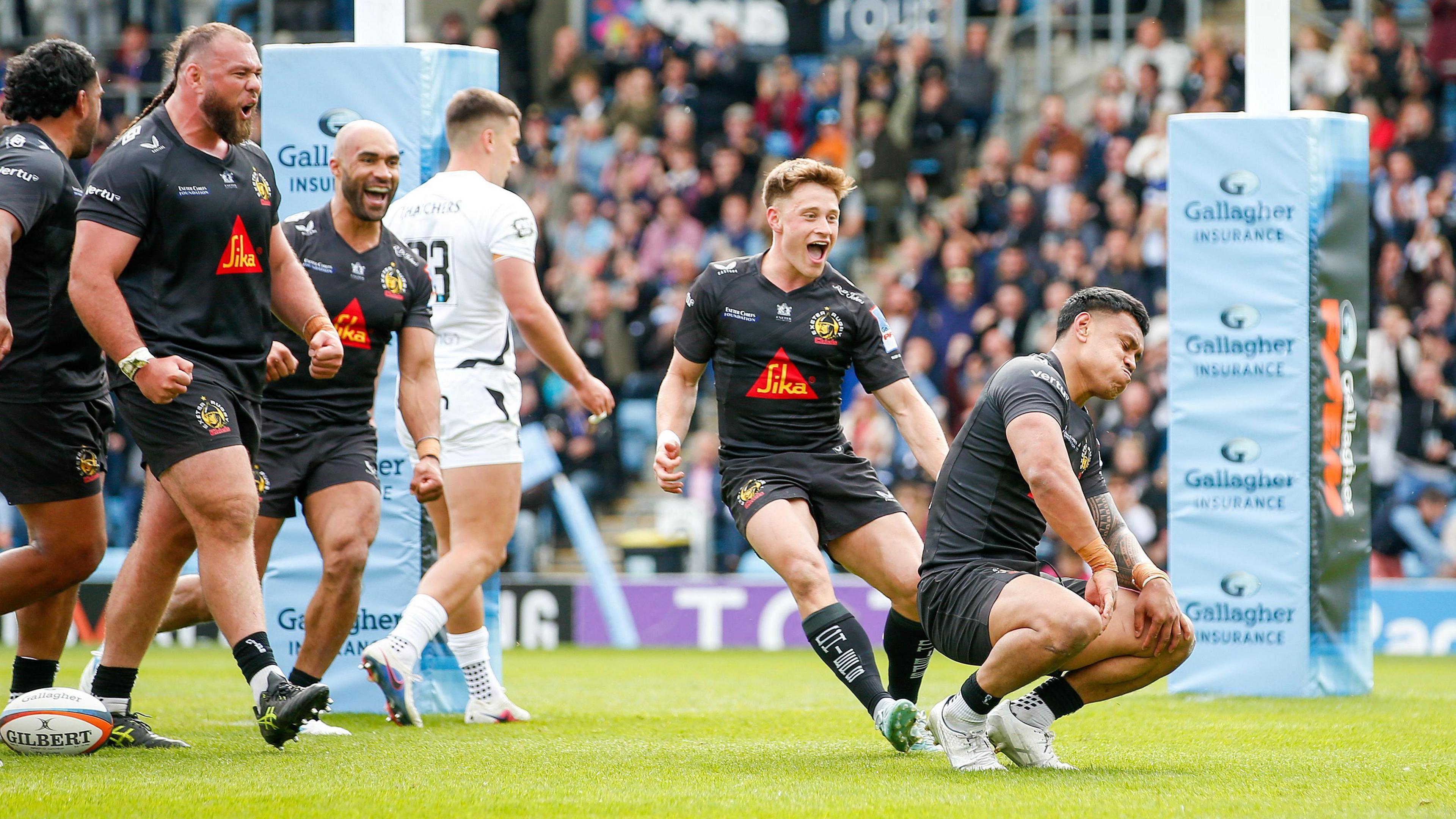 Len Ikitau celebrates scoring for Exeter