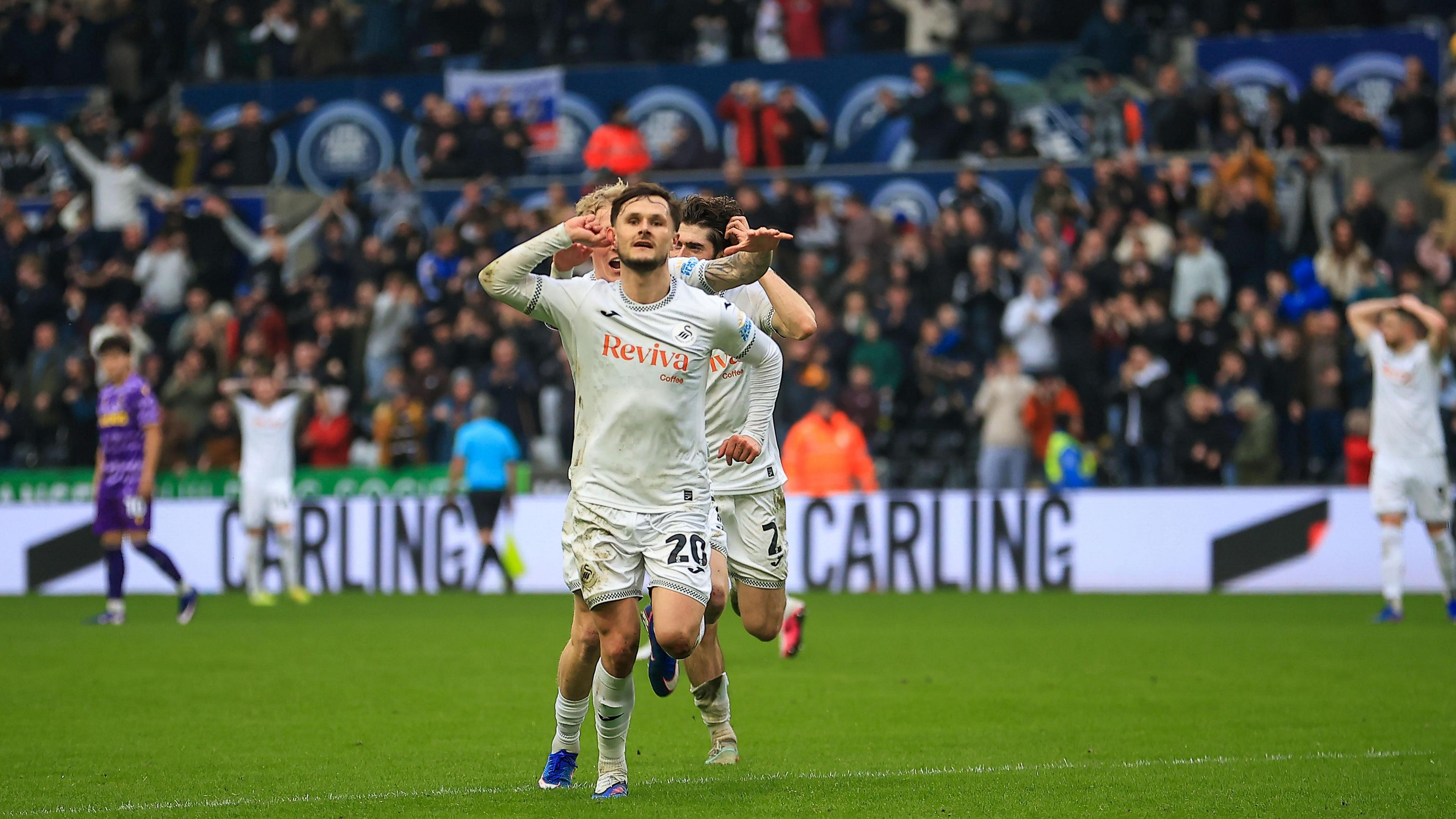 Liam Cullen celebrates his goal for Swansea against Stoke