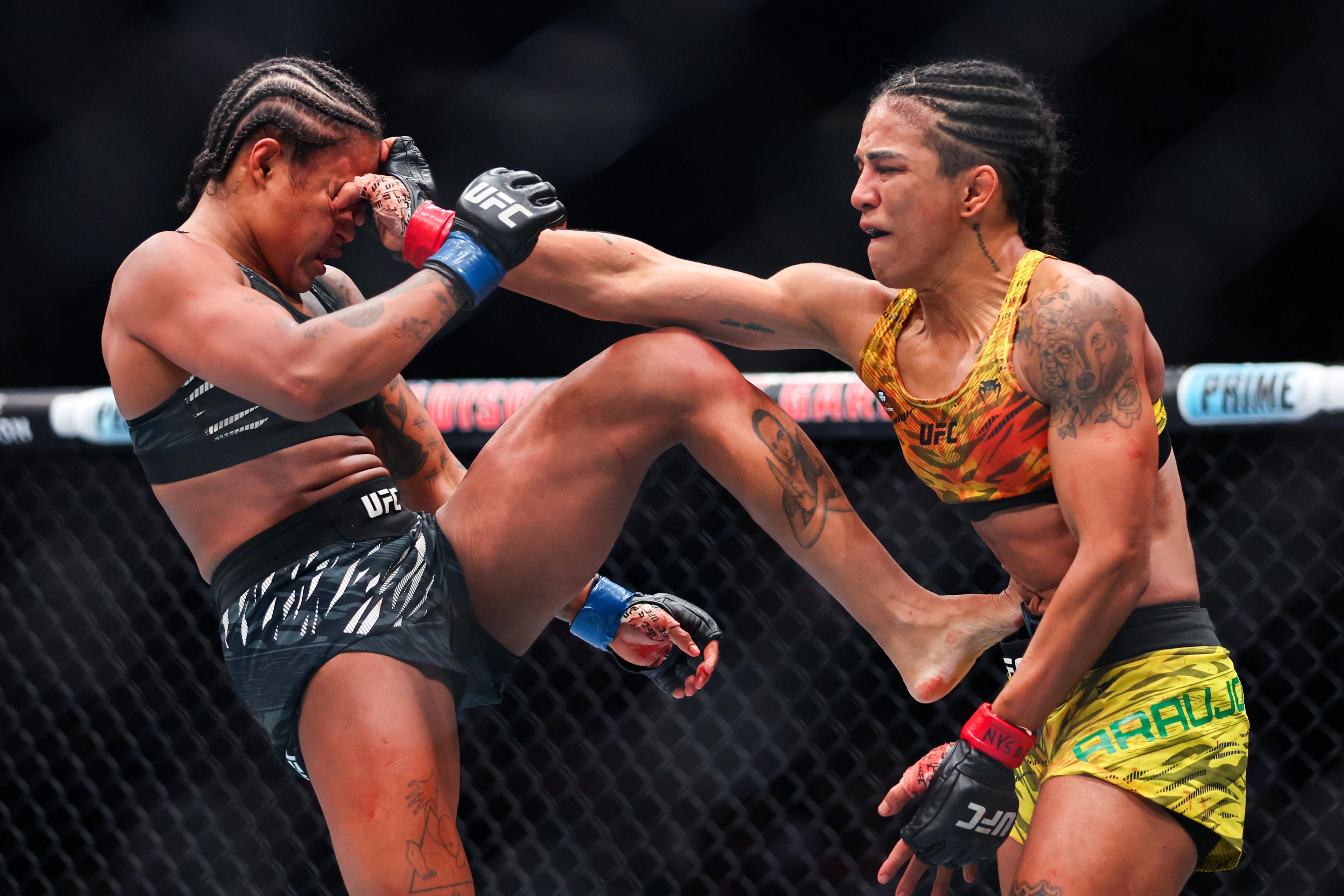 Karine Silva of Brazil and Viviane Araujo also of Brazil trade hits in a strawweight fight during the UFC 309 event at Madison Square Garden on 16 November 2024 in New York City.