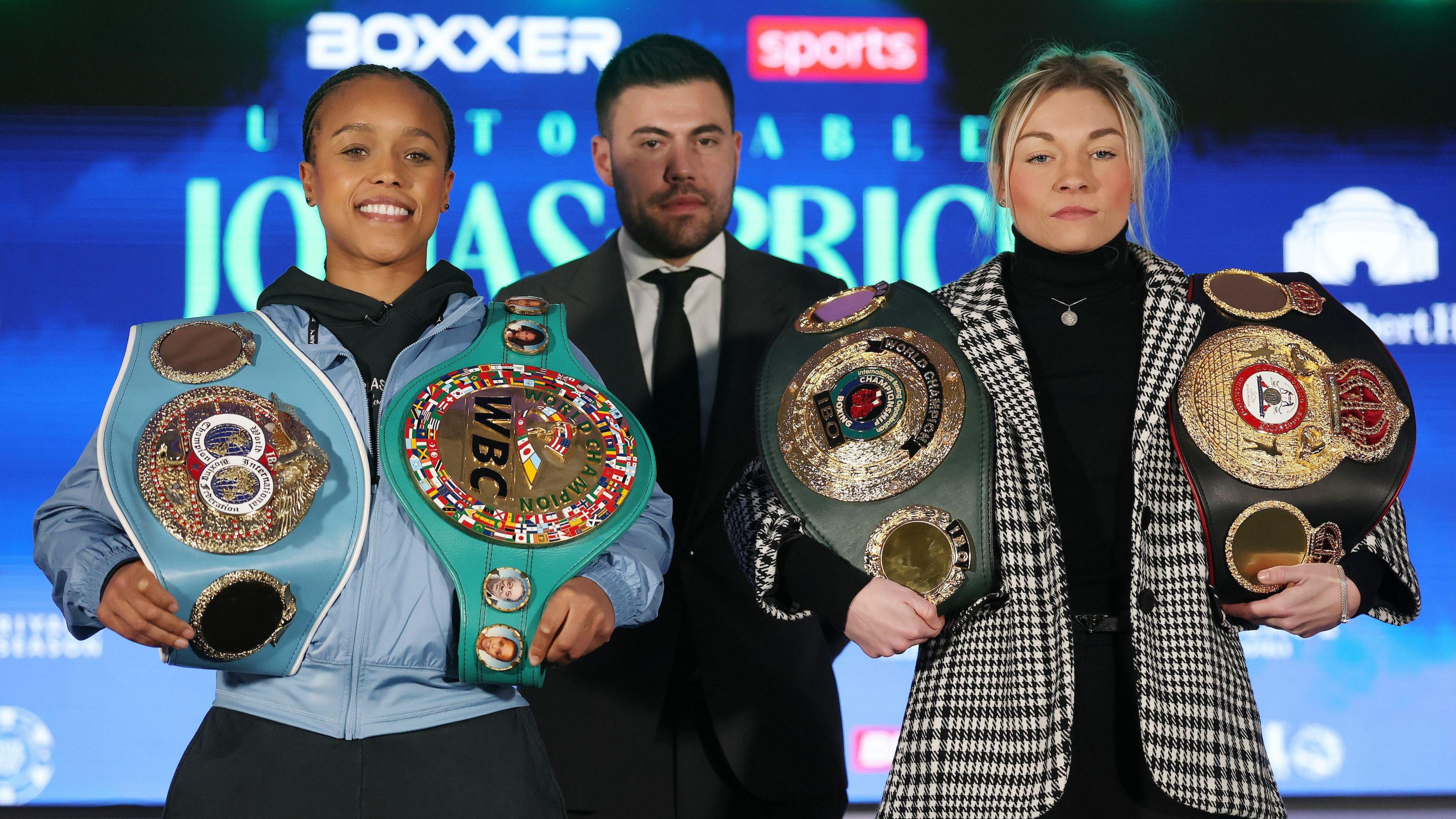 LONDON, ENGLAND - JANUARY 21: Natasha Jonas (L) and Lauren Price (R) face off with Ben Shalom, CEO of Boxxer during the Natasha Jonas vs Lauren Price: Unstoppable Press Conference at Dorchester Hotel on January 21, 2025 in London, England. (Photo by Richard Pelham/Getty Images)
