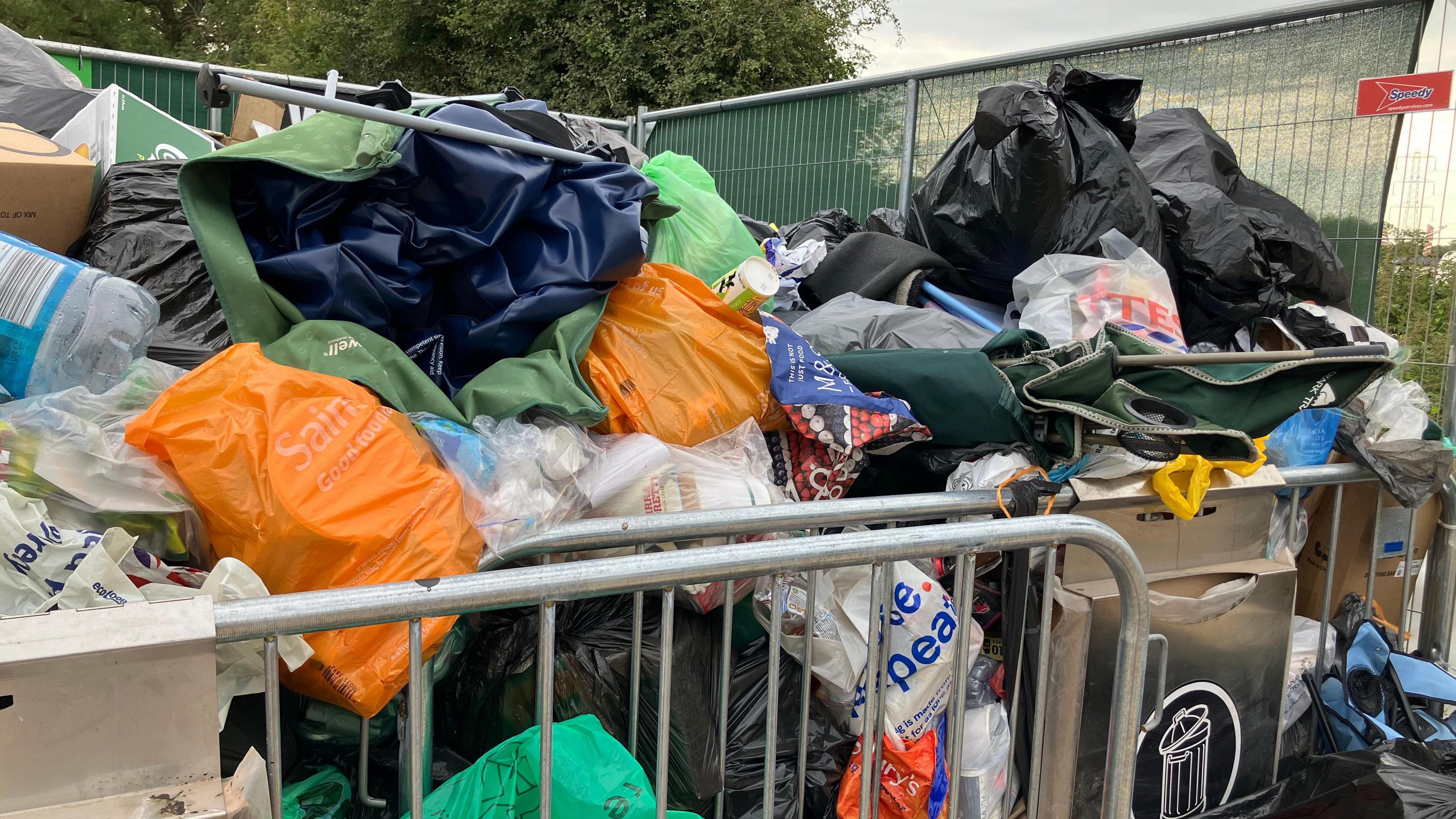 Bins full of rubbish in a skip