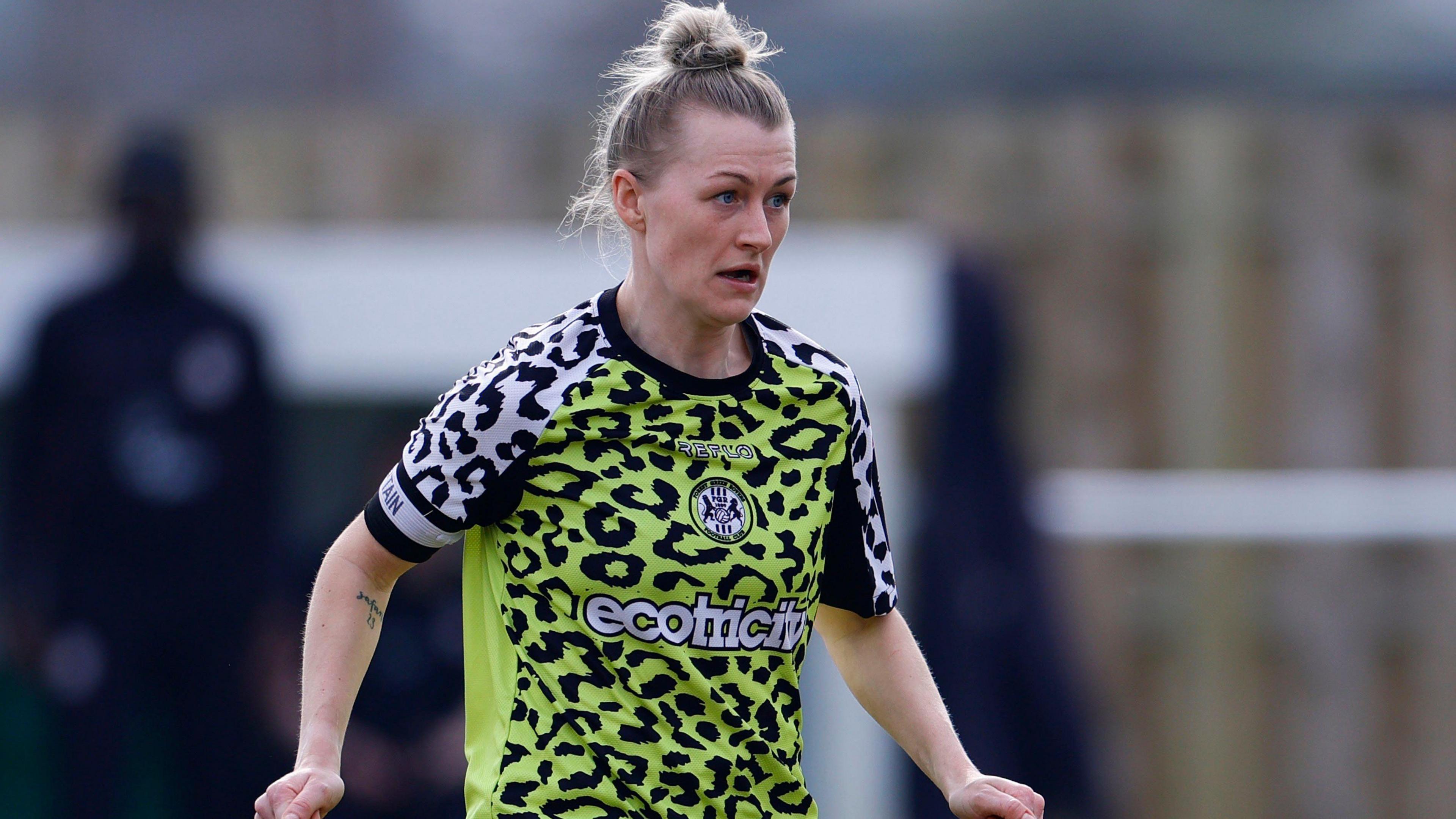 Hattie Jones running with the ball at her feet during a match for Forest Green Rovers Women