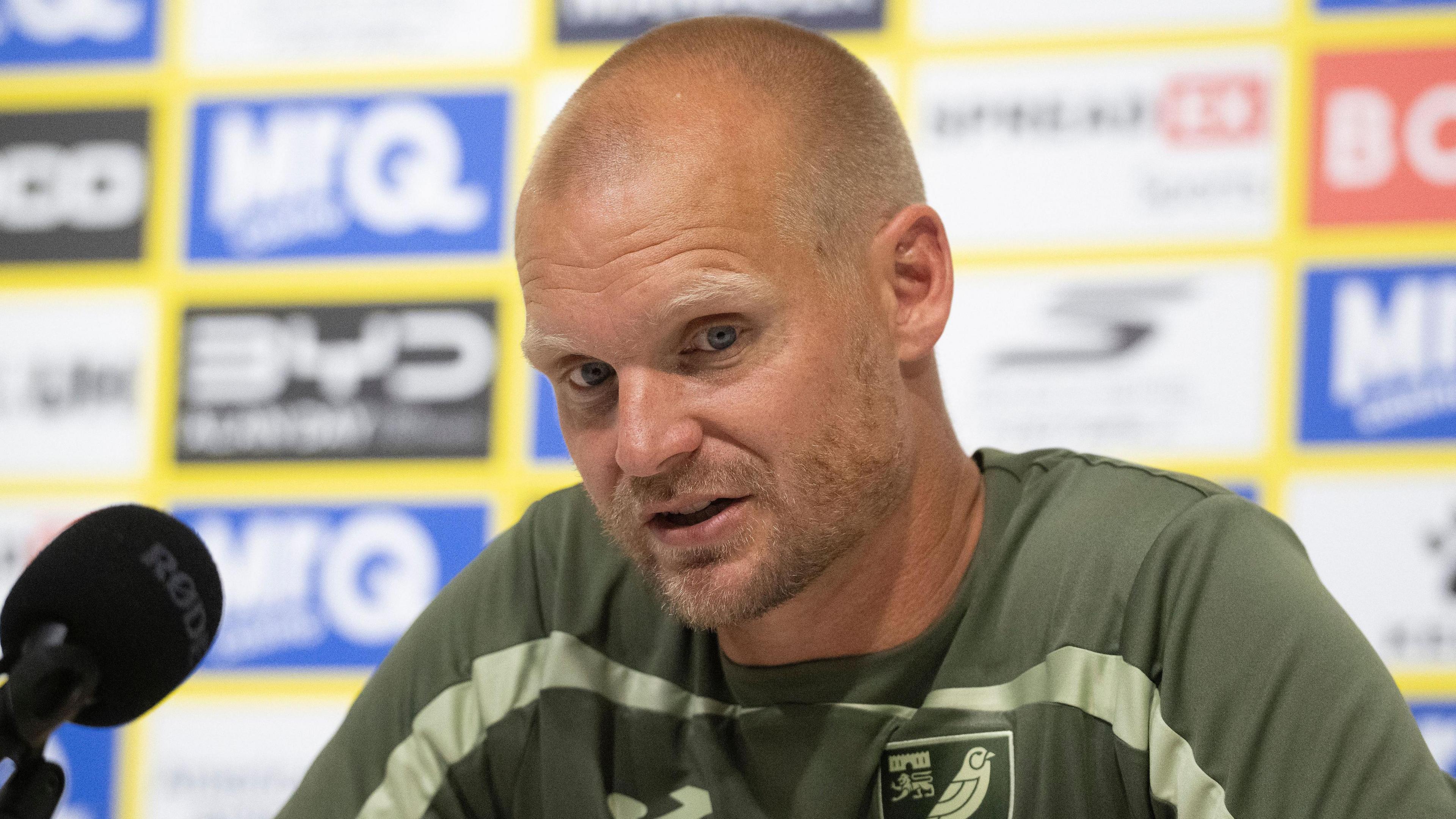 Liam Manning during a pre-match press conference