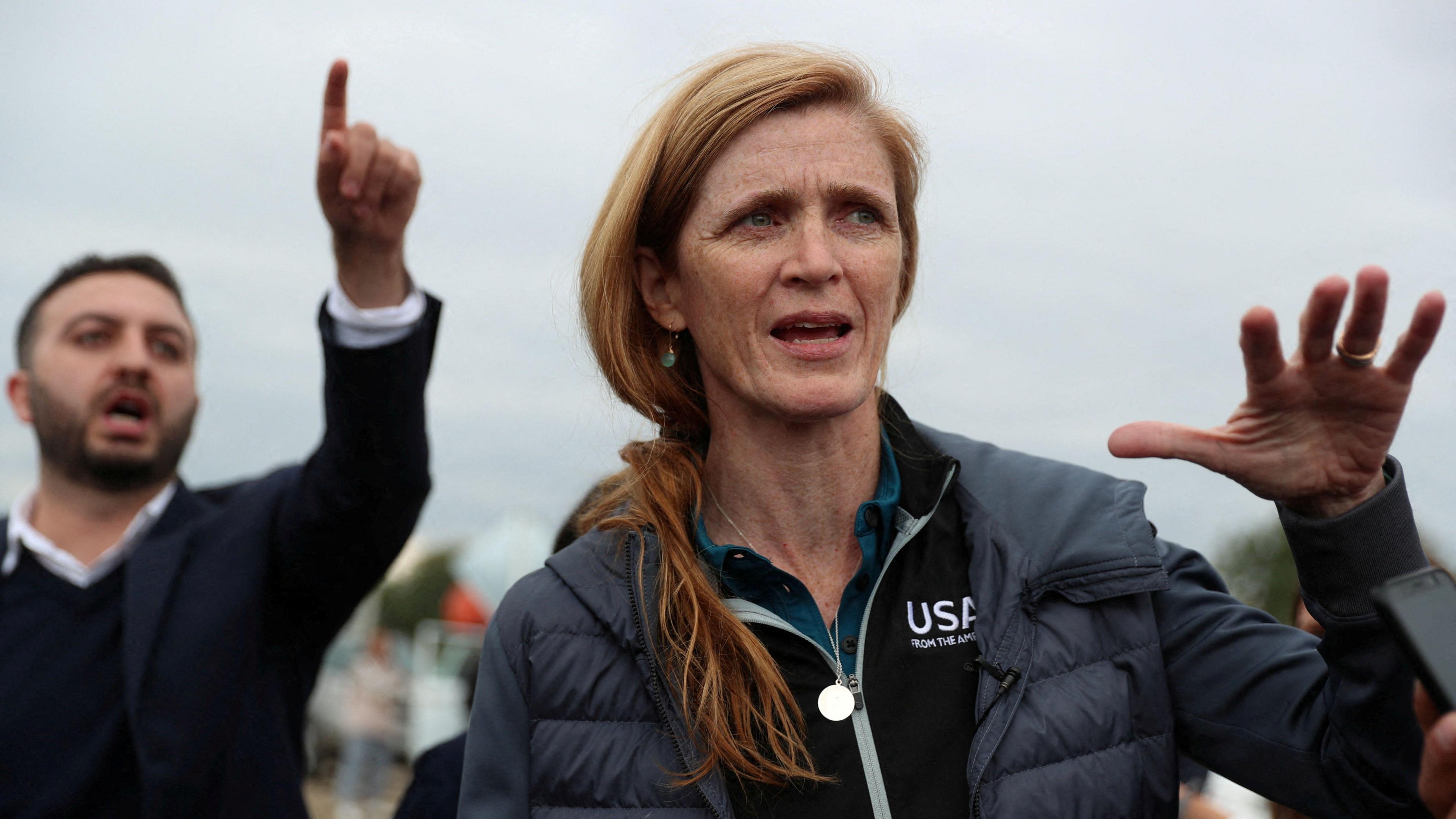 Former US Agency for International Development (USAID) Administrator Samantha Power speaks to the media as she visits the aid centre for refugees from Nagorno-Karabakh region in the border village of Kornidzor, Armenia. She is wearing a dark coat and US AID fleece. 