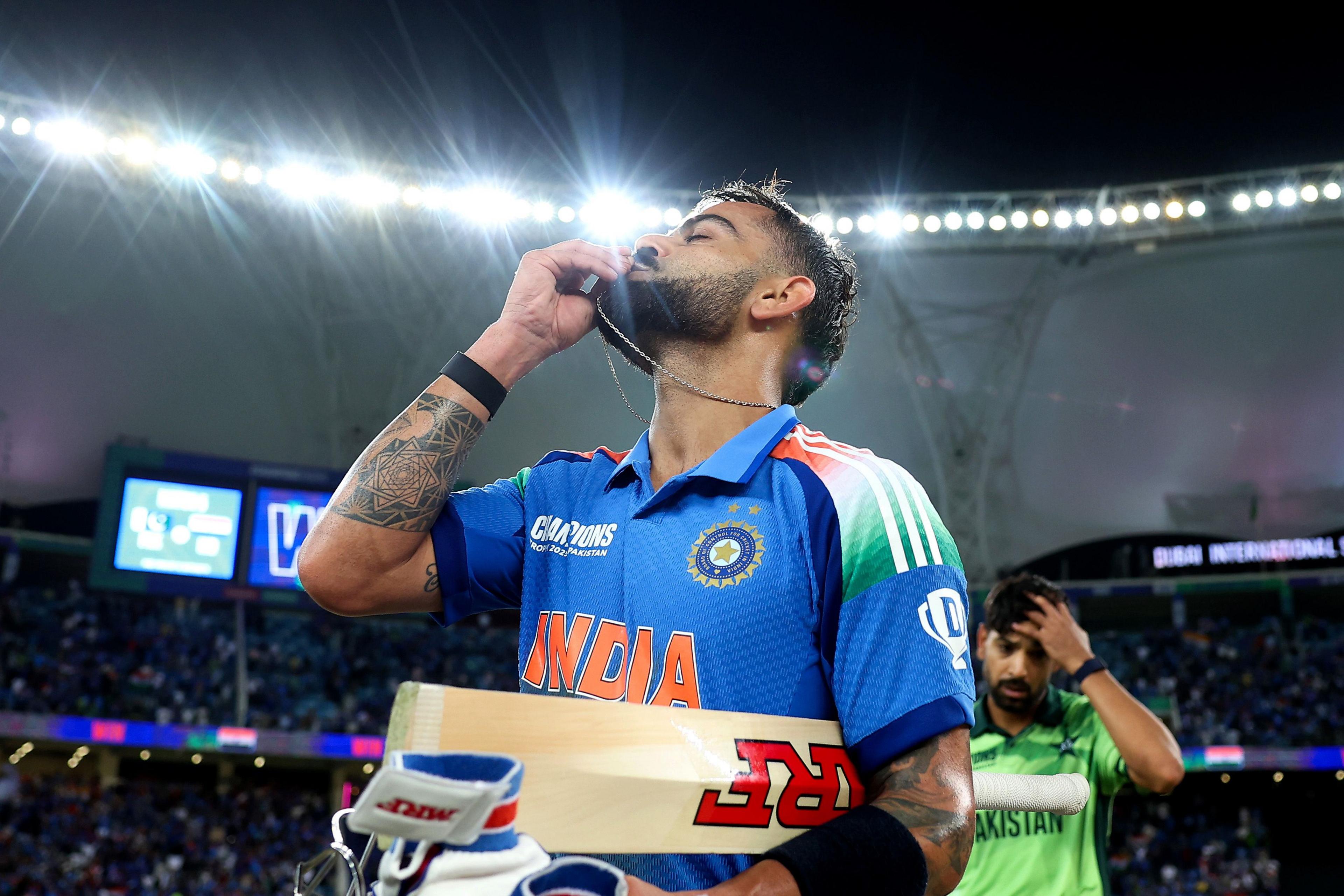 India's Virat Kohli celebrates scoring a century during their Champions Trophy victory over Pakistan in Dubai