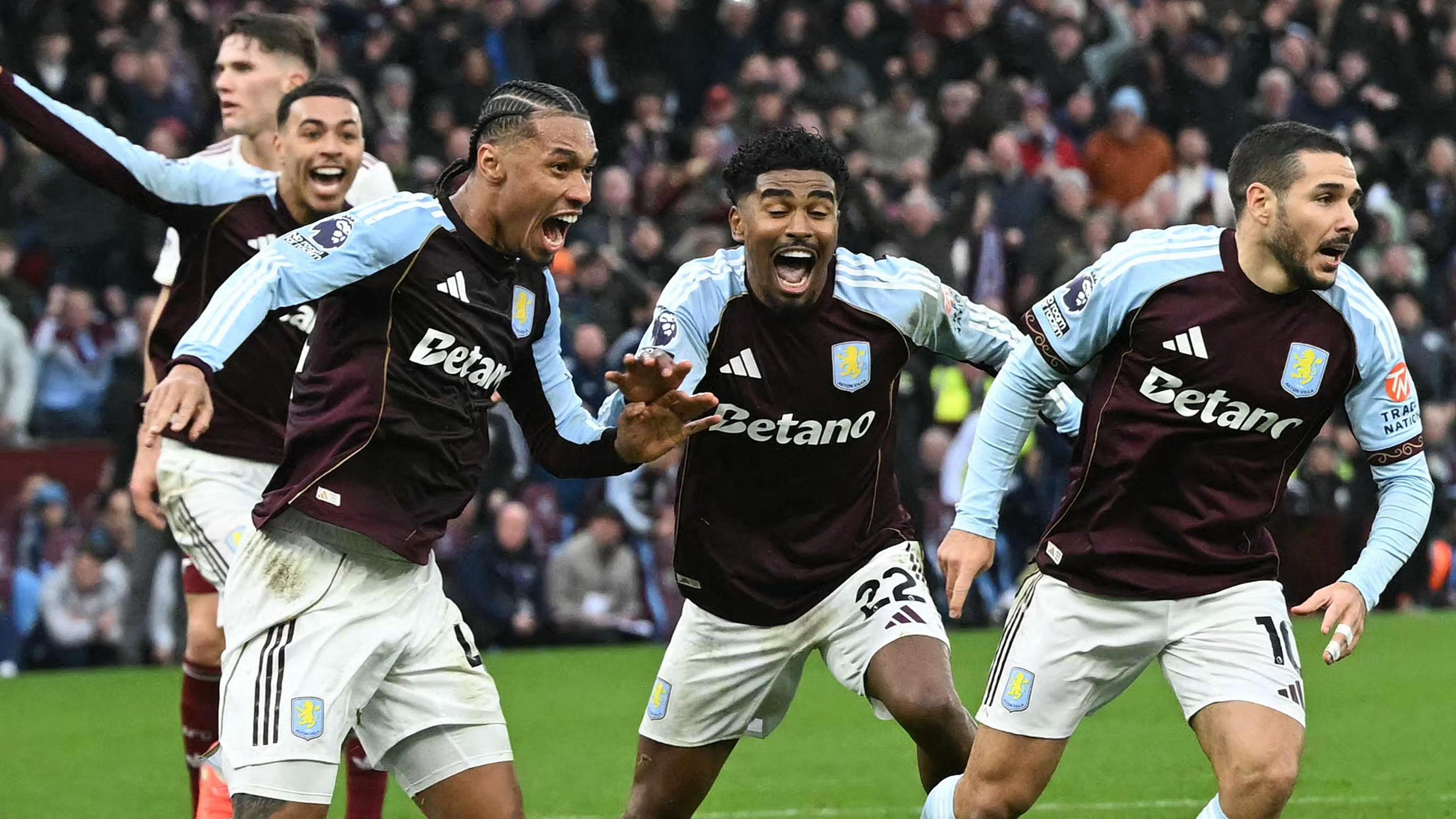 Emi Buendia and Villa team-mates celebrate his winner