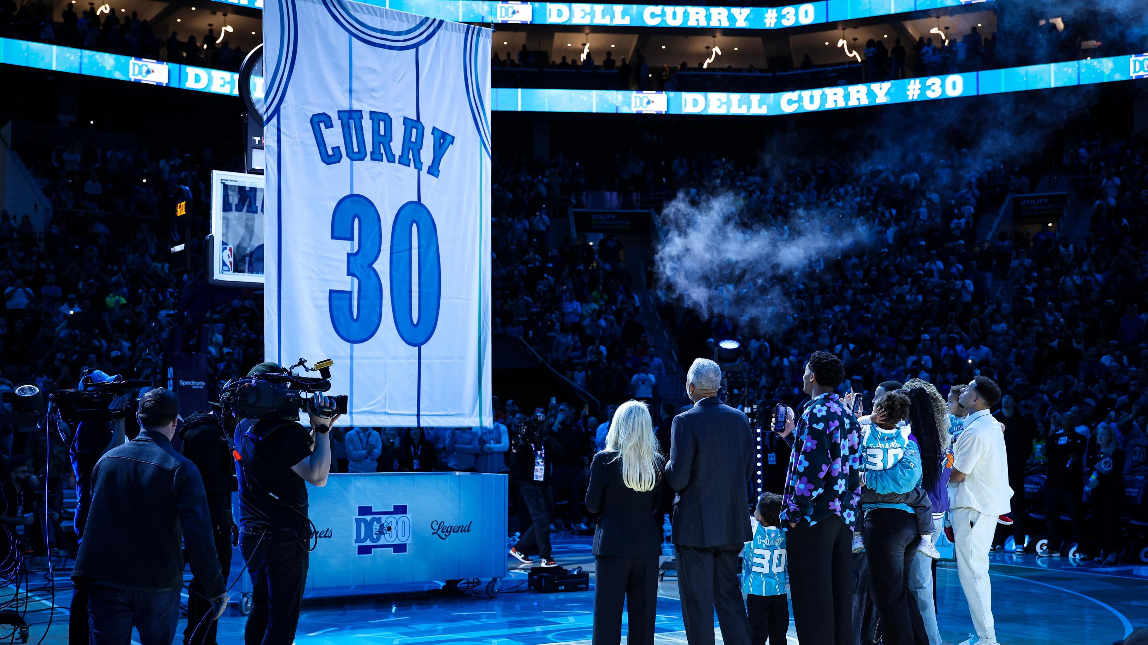 Former Charlotte Hornets Legend Dell Curry has his jersey hung in the rafters during half-time of a basketball game between the Charlotte Hornets and the Orlando Magic at Spectrum Center.