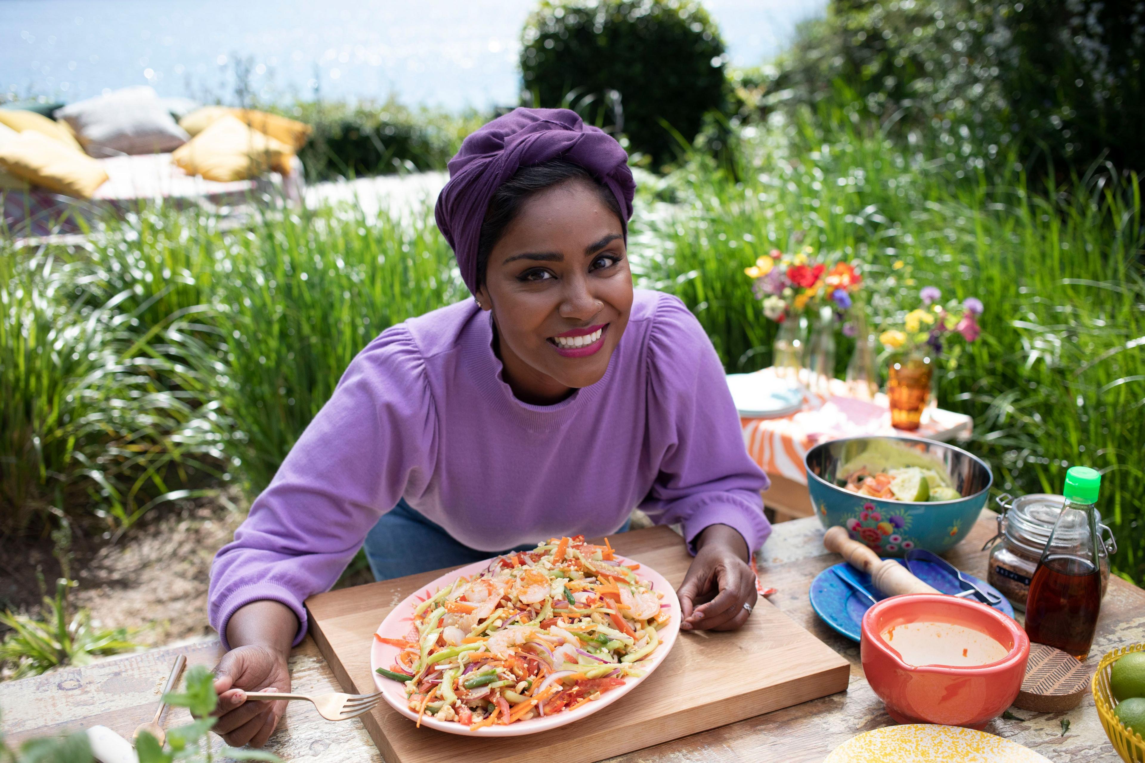 nadiya hussain eating a vibrant salad in the garden