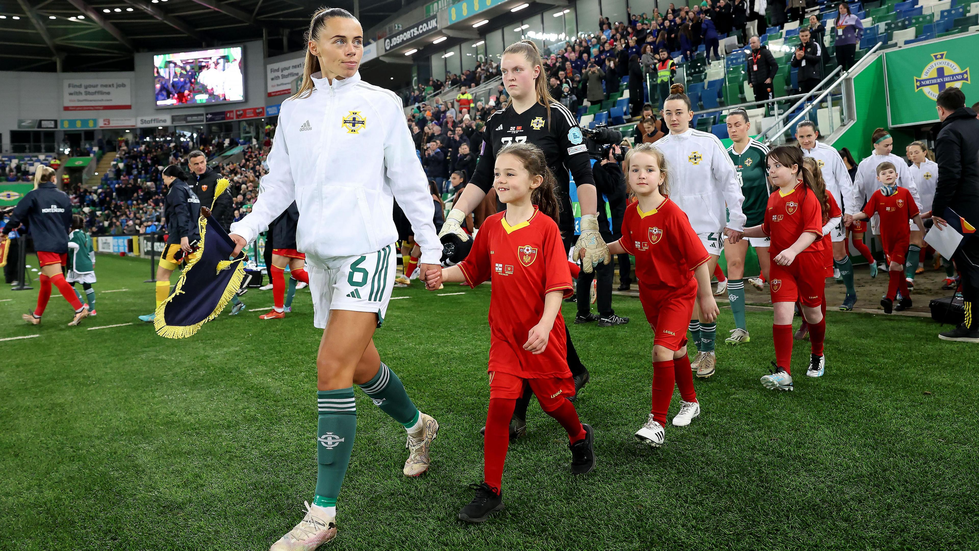 Laura Rafferty leads the team on to the pitch