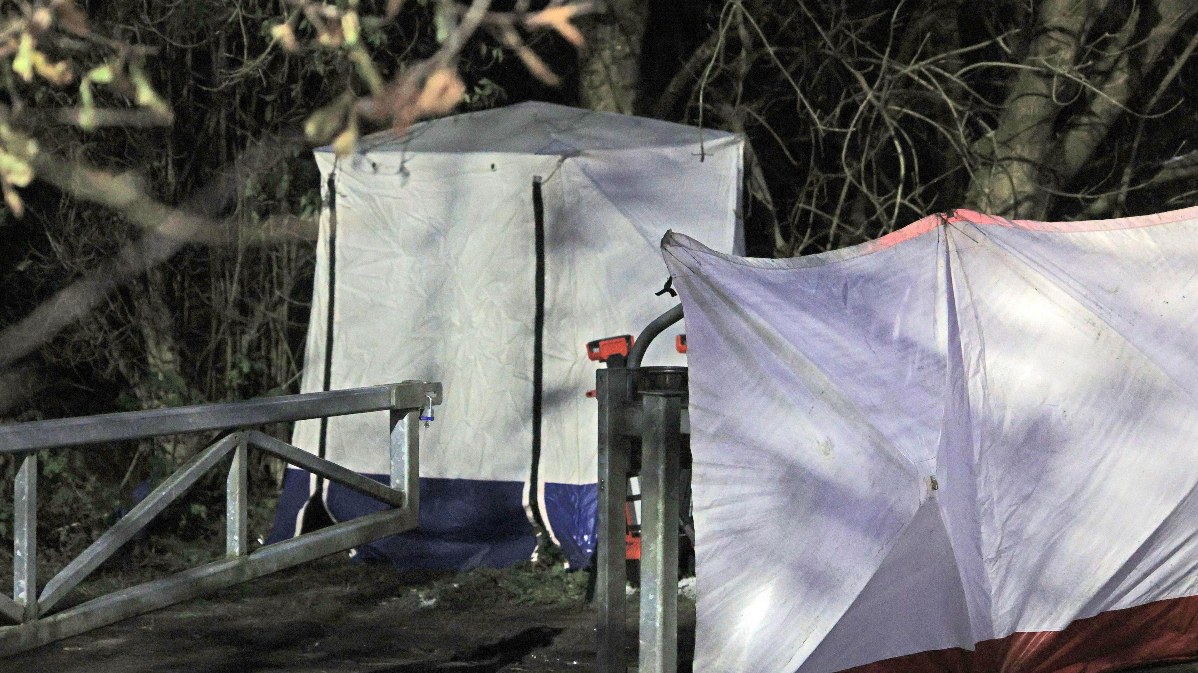 A police tent at the scene on Ravenscraig Road near Ashtons Field, Salford, in Greater Manchester, where the remains of a baby were found in a field.