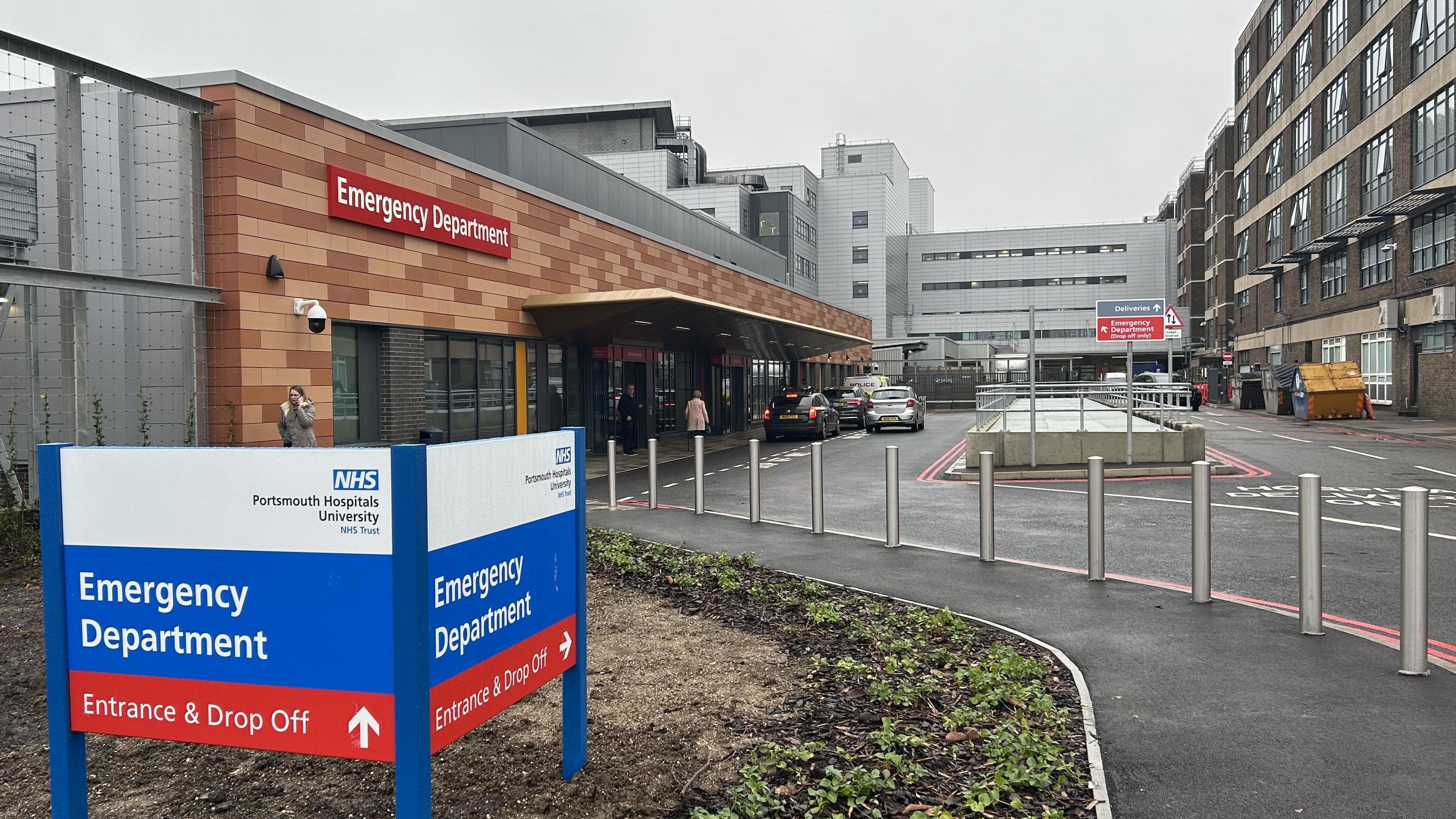 The outside of QA hospital's new emergency department showing signs and the drop off area. 