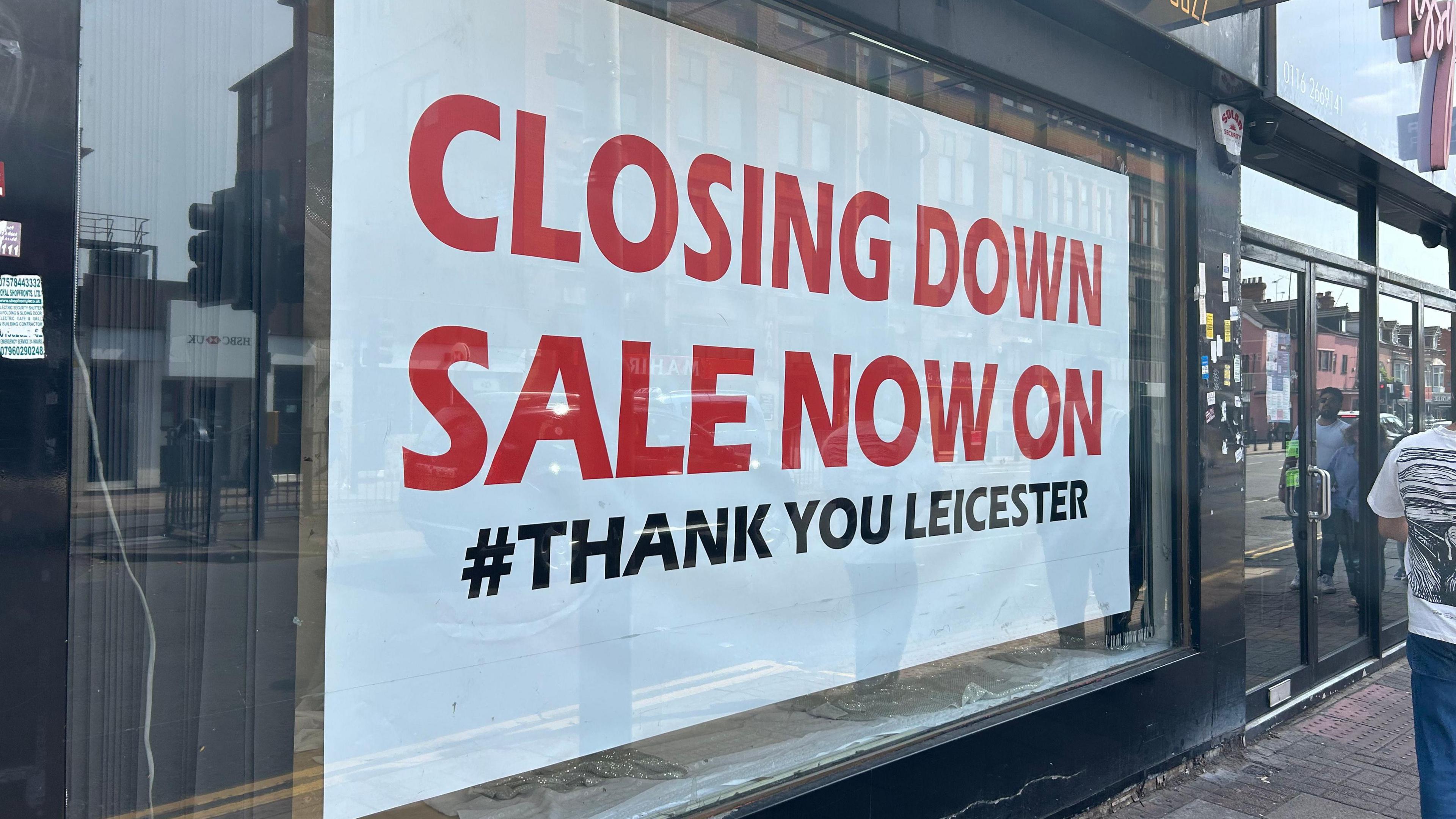 A shop window with a sign that reads "Closing Down Sale Now On #thank you Leicester"