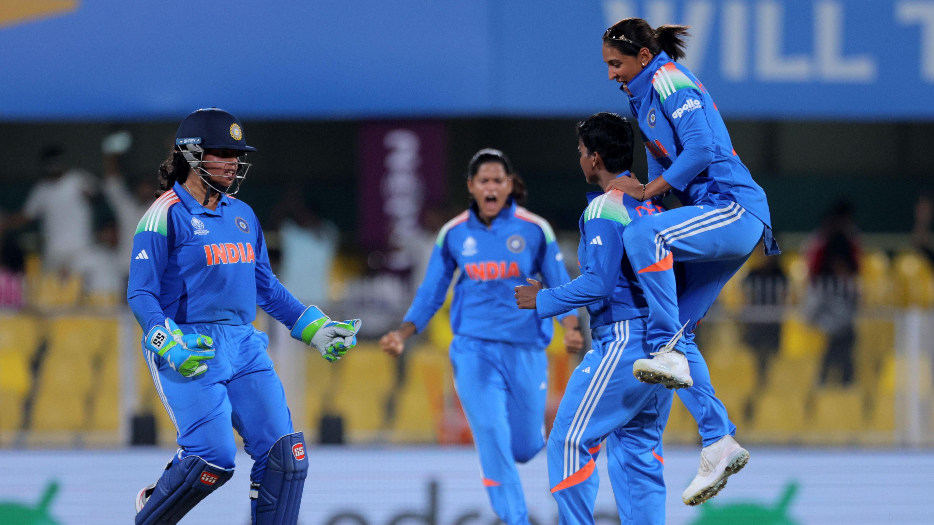 Deepti Sharma of India celebrates with team mates Harmanpreet Kaur and Richa Ghosh after taking the wicket of Chamari Athapaththu of Sri Lanka (not pictured) during the ICC Women's Cricket World Cup India 2025 match between India and Sri Lanka at Barsapara Cricket Stadium on September 30, 2025 in Guwahati, India.