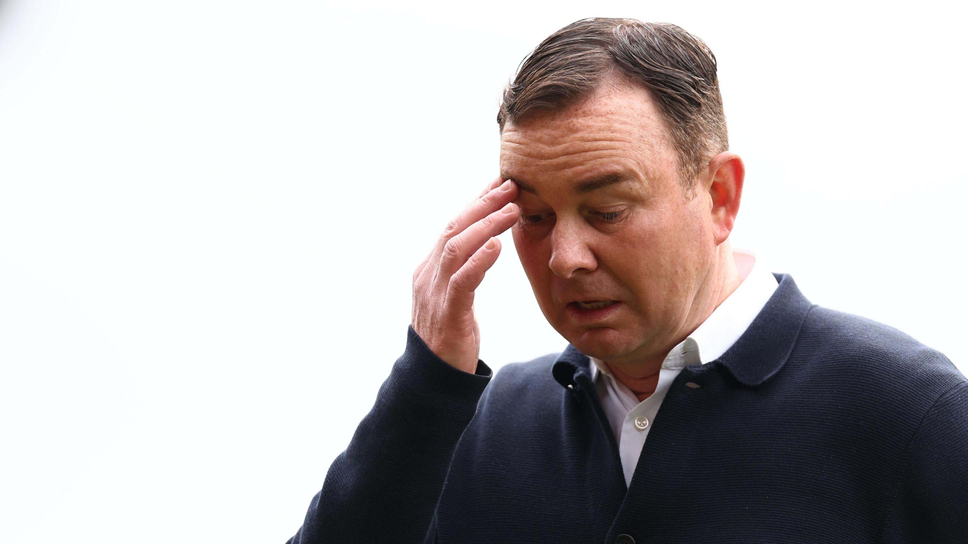 Morecambe boss Derek Adams looks dejected during the 2024-25 League Two season