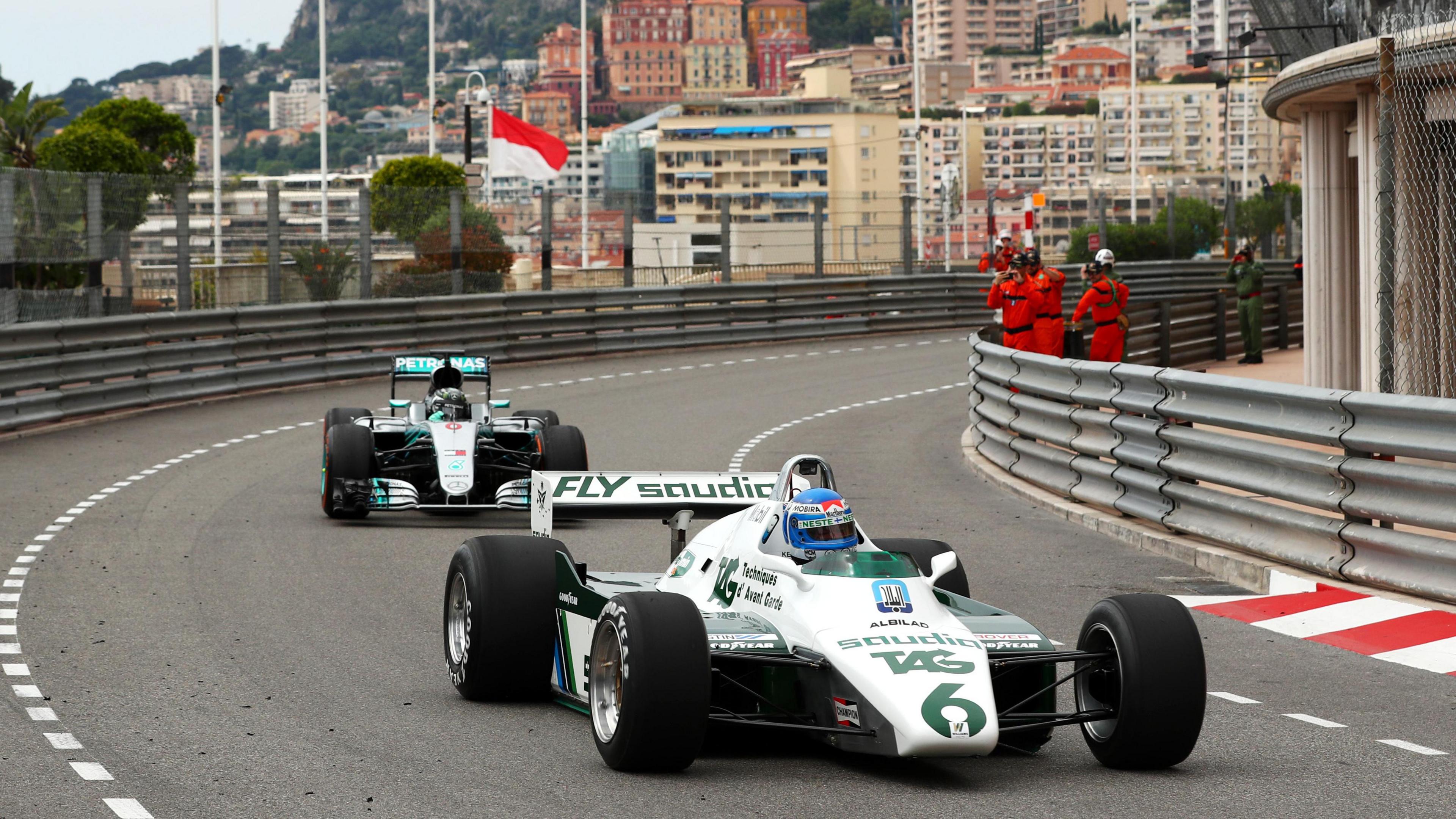 Father and son Keke and Nico Rosberg go for a demonstration drive in their respective world championship-winning cars in 2018 - Keke is leading the way in his 1982 Williams with Nico behind him in the 2016 Mercedes