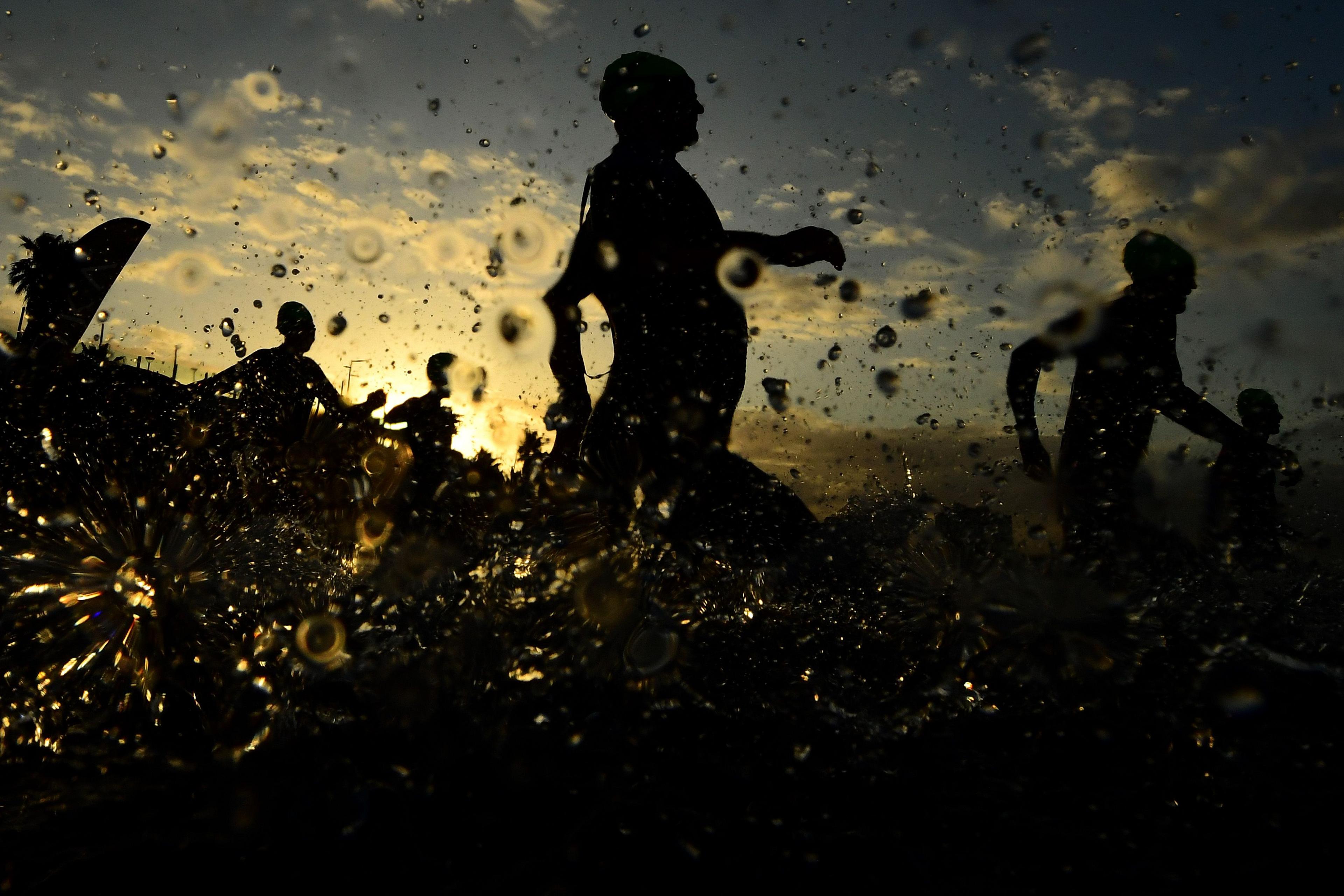 Competitors enter the water at St Kilda Beach during Ironman 70.3 Melbourne on 10 November 2024 in Melbourne, Australia.